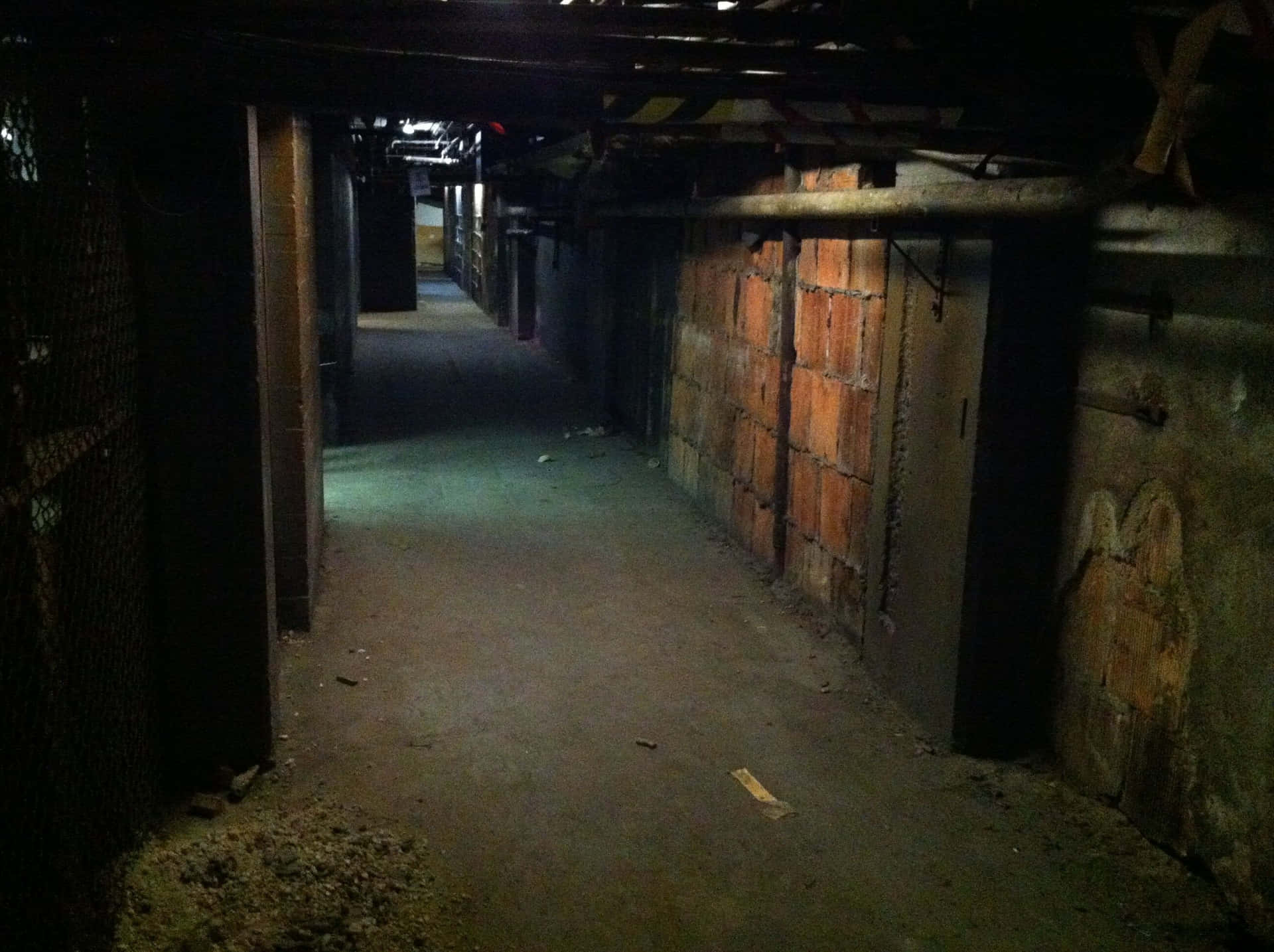 A Dark Hallway With A Light On It