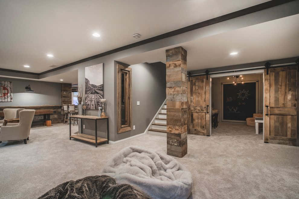 A Basement With A Fireplace And A Couch
