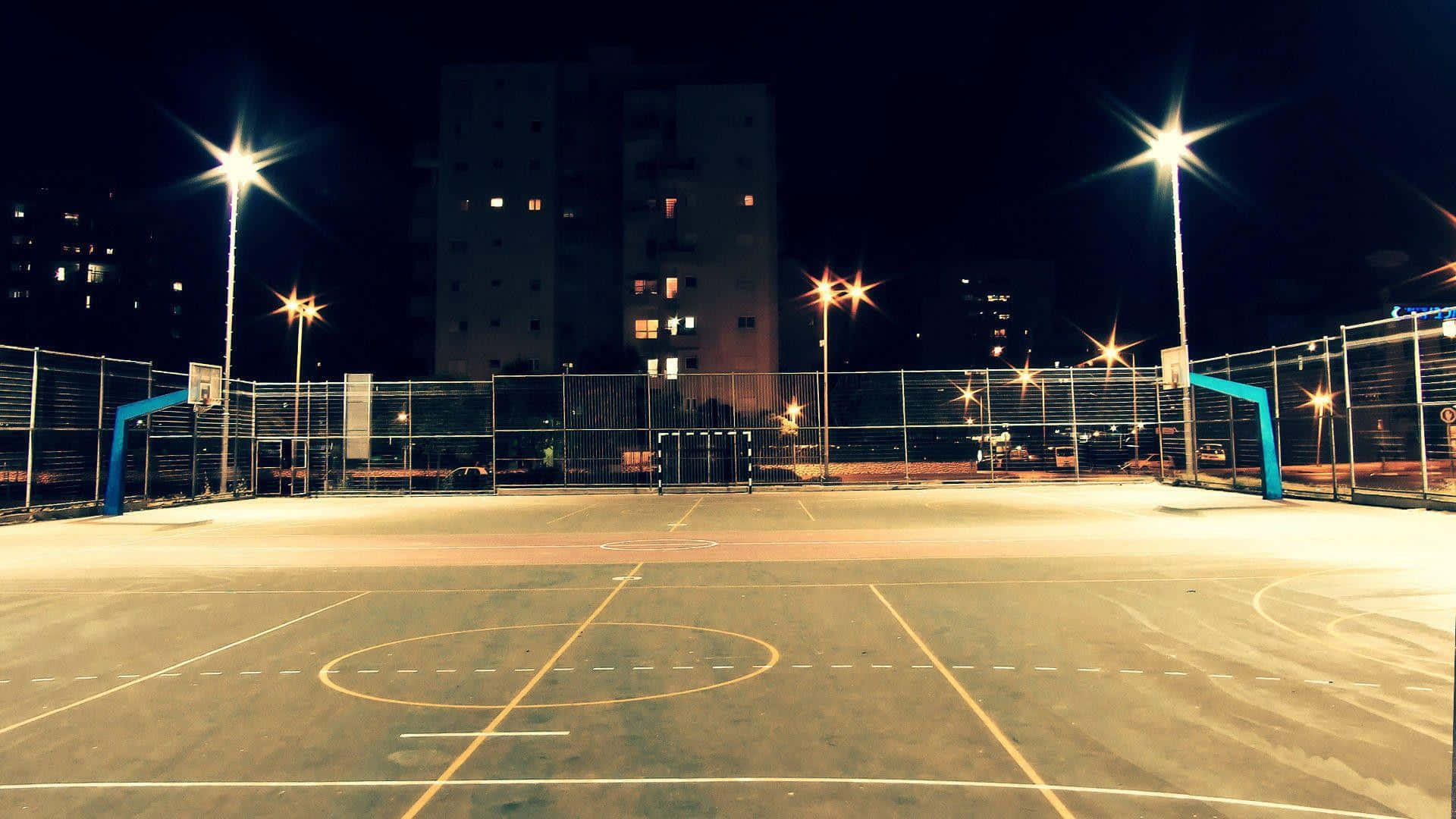 A Basketball Court At Night