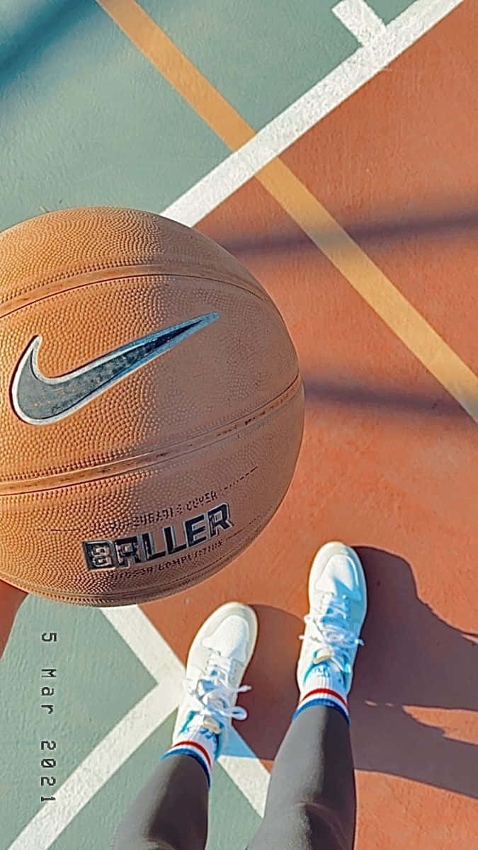 Basketball Court Viewwith Sneakersand Ball.jpg Wallpaper