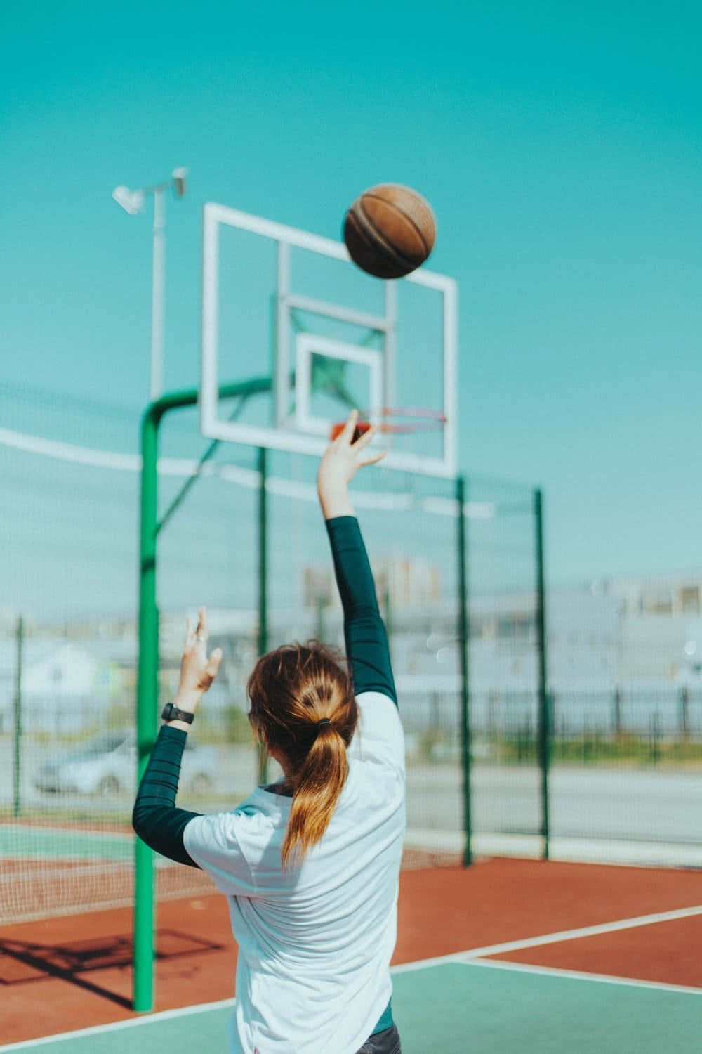 Basketball Girl Shooting Hoop Outdoor Court.jpg Wallpaper