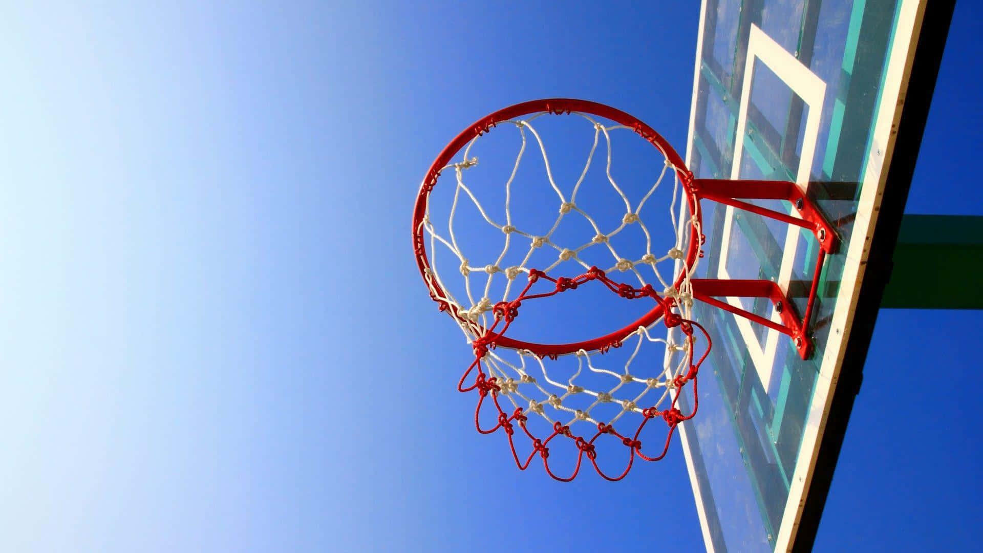 Basketball Hoop Against Blue Sky Wallpaper