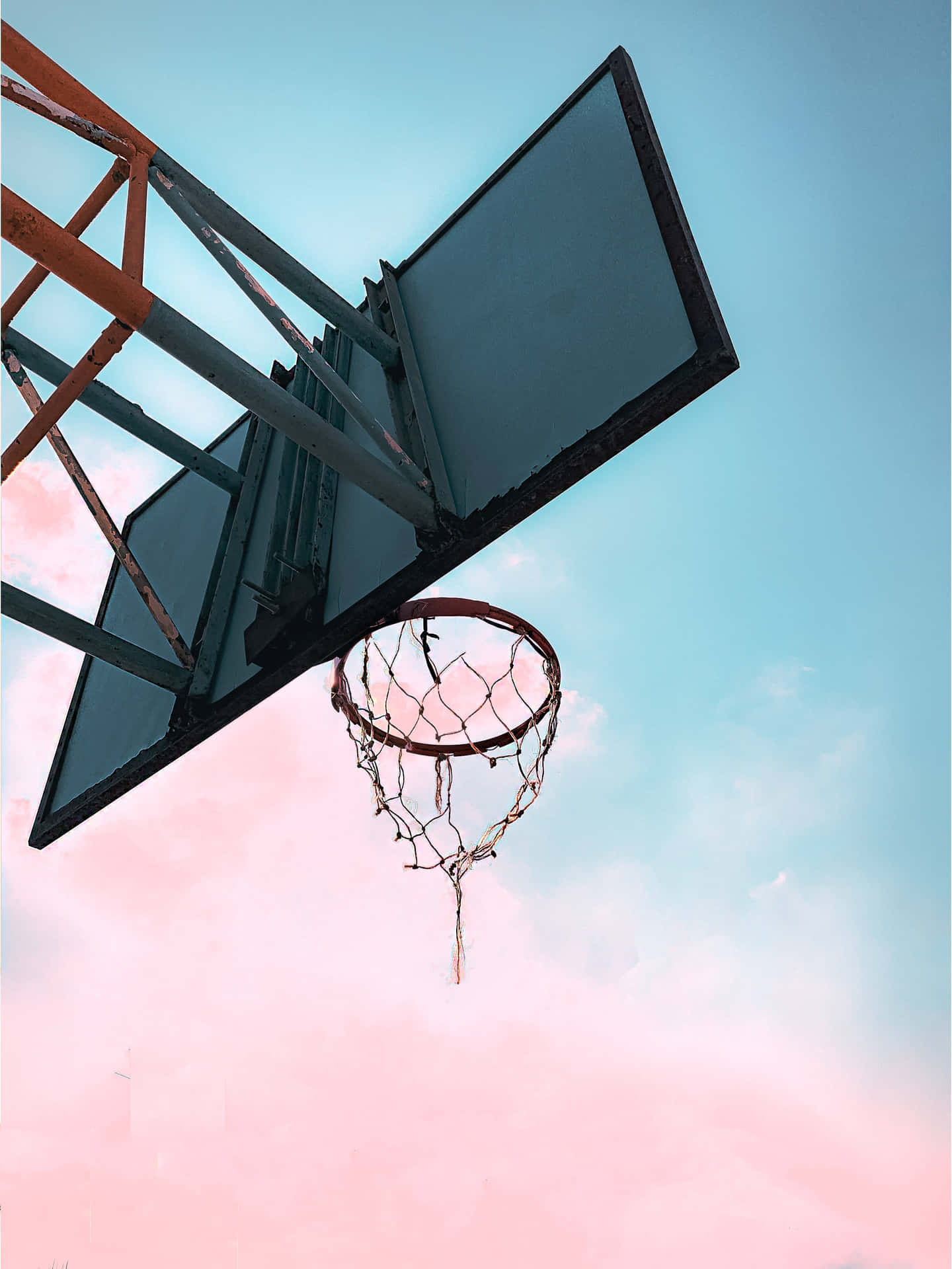 Basketball Hoop Against Pink Sky Wallpaper