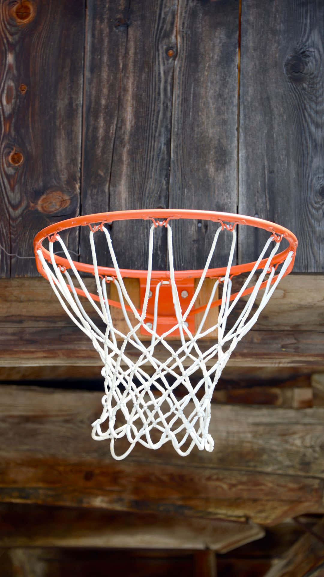 Basketball Hoop Against Wooden Backdrop Wallpaper