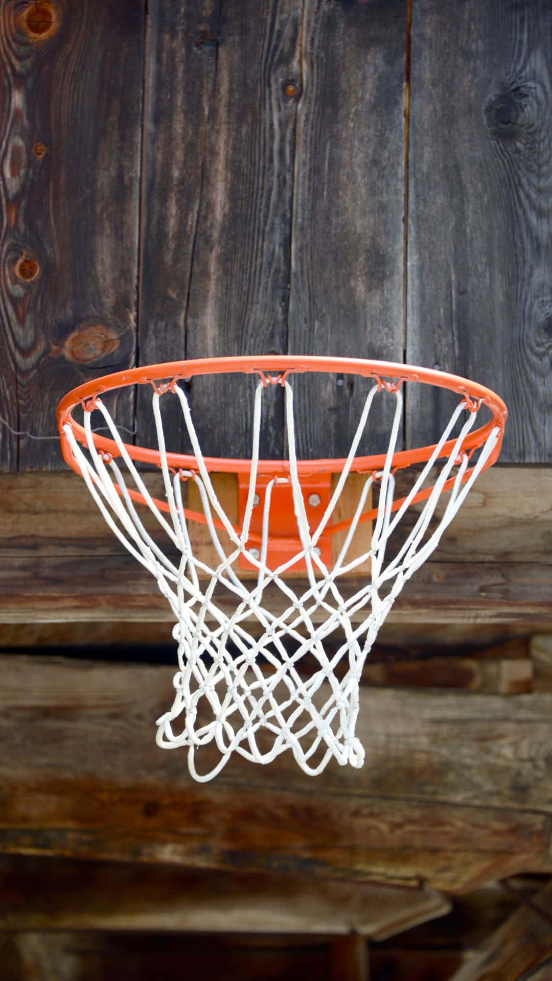 Download Basketball Hoop Against Wooden Backdrop Wallpaper | Wallpapers.com