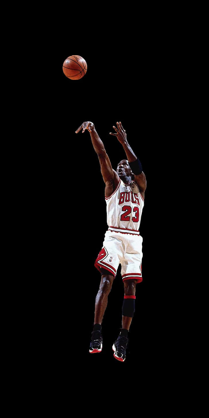 Basketball legenden Michael Jordan skyder et afgørende tre-point skud. Wallpaper