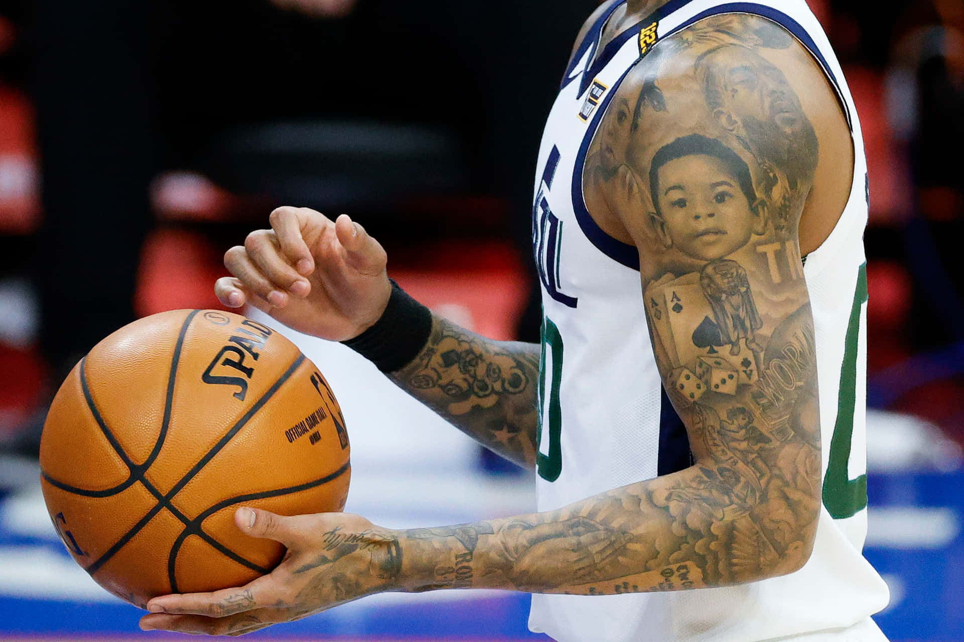 Basketball Player Tattooed Arm Holding Ball Wallpaper