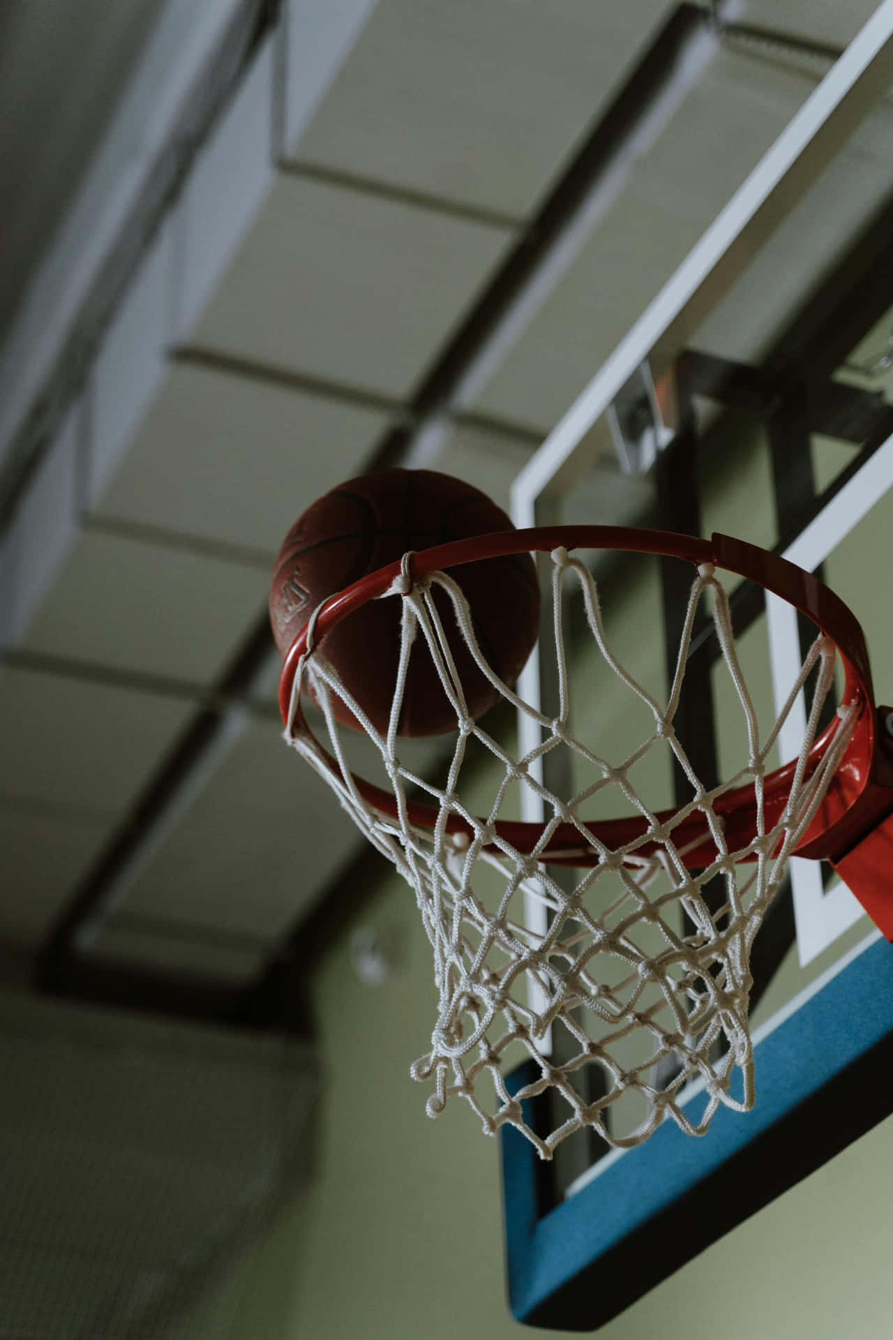 Basketball Swishing Through Hoop Wallpaper