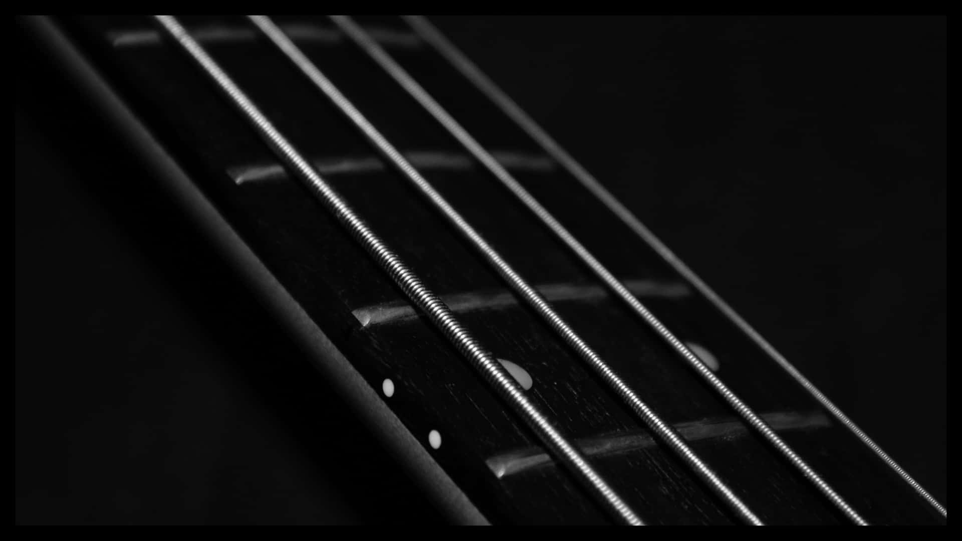 Imagenen Primer Plano De Una Atractiva Guitarra Eléctrica Negra Fondo de pantalla