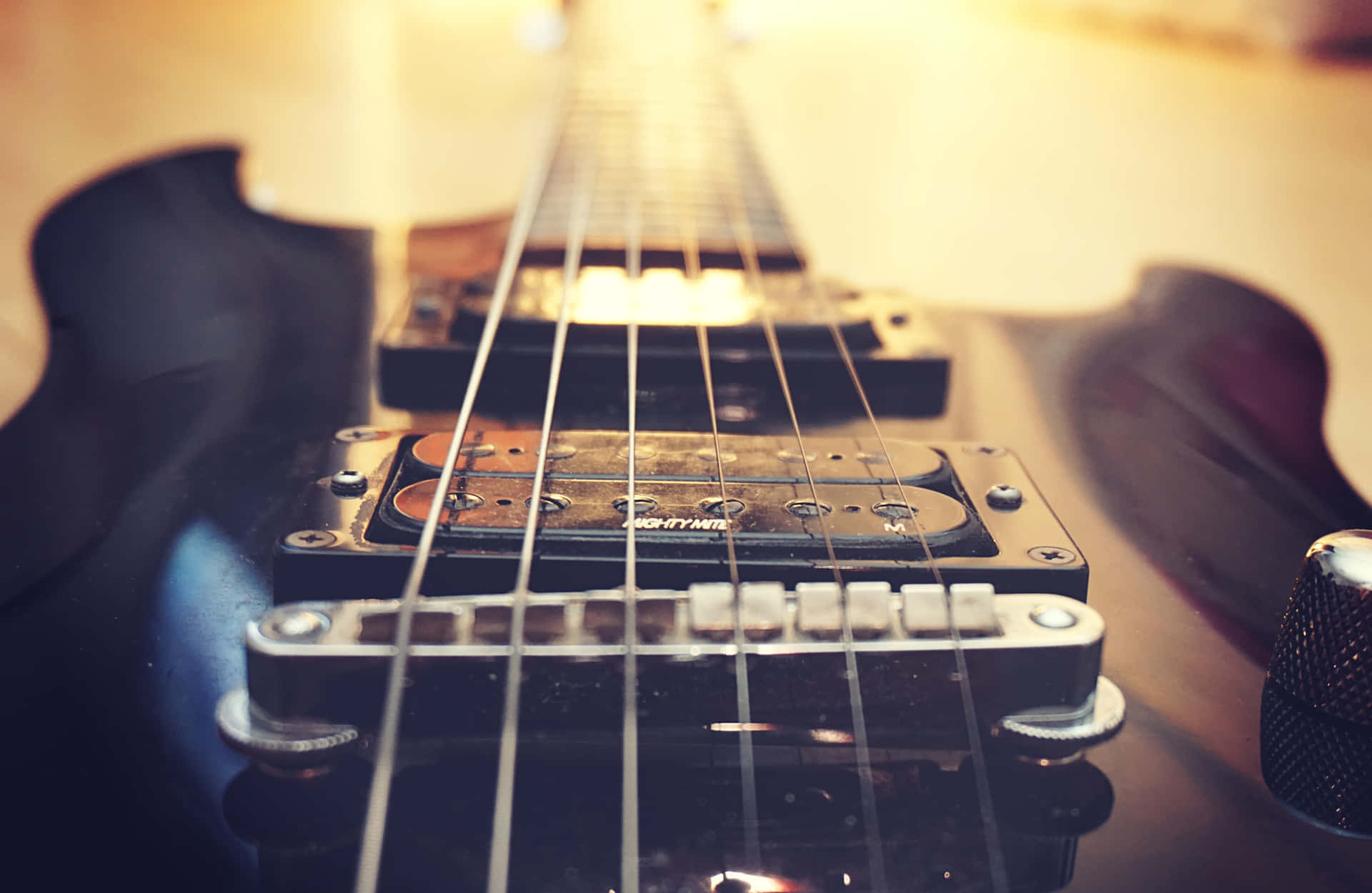 "An Up-Close Look at the Stunning Detail of a Bass Guitar" Wallpaper