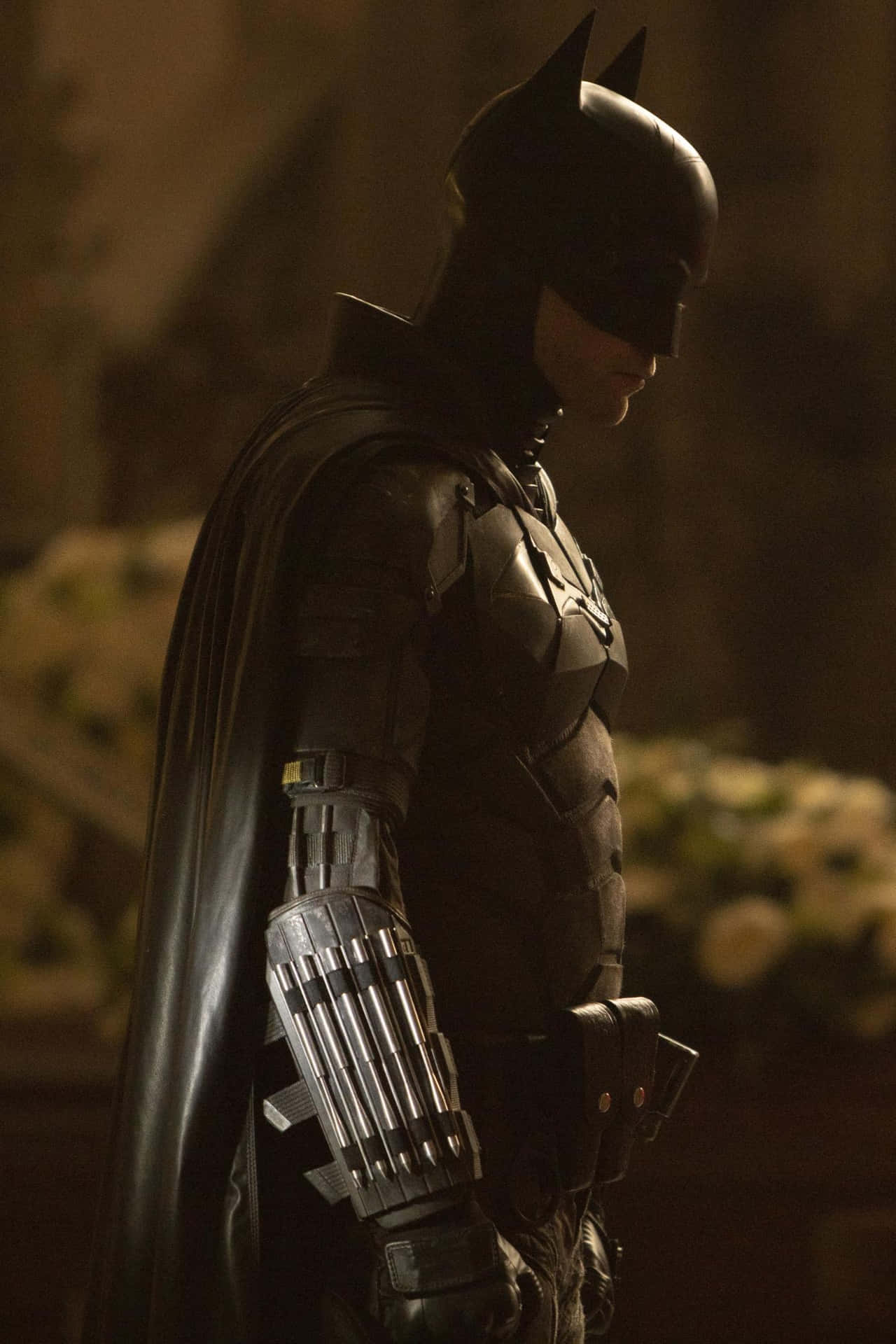The Dark Knight Preparing for Battle with a Detailed Bat-Suit Wallpaper
