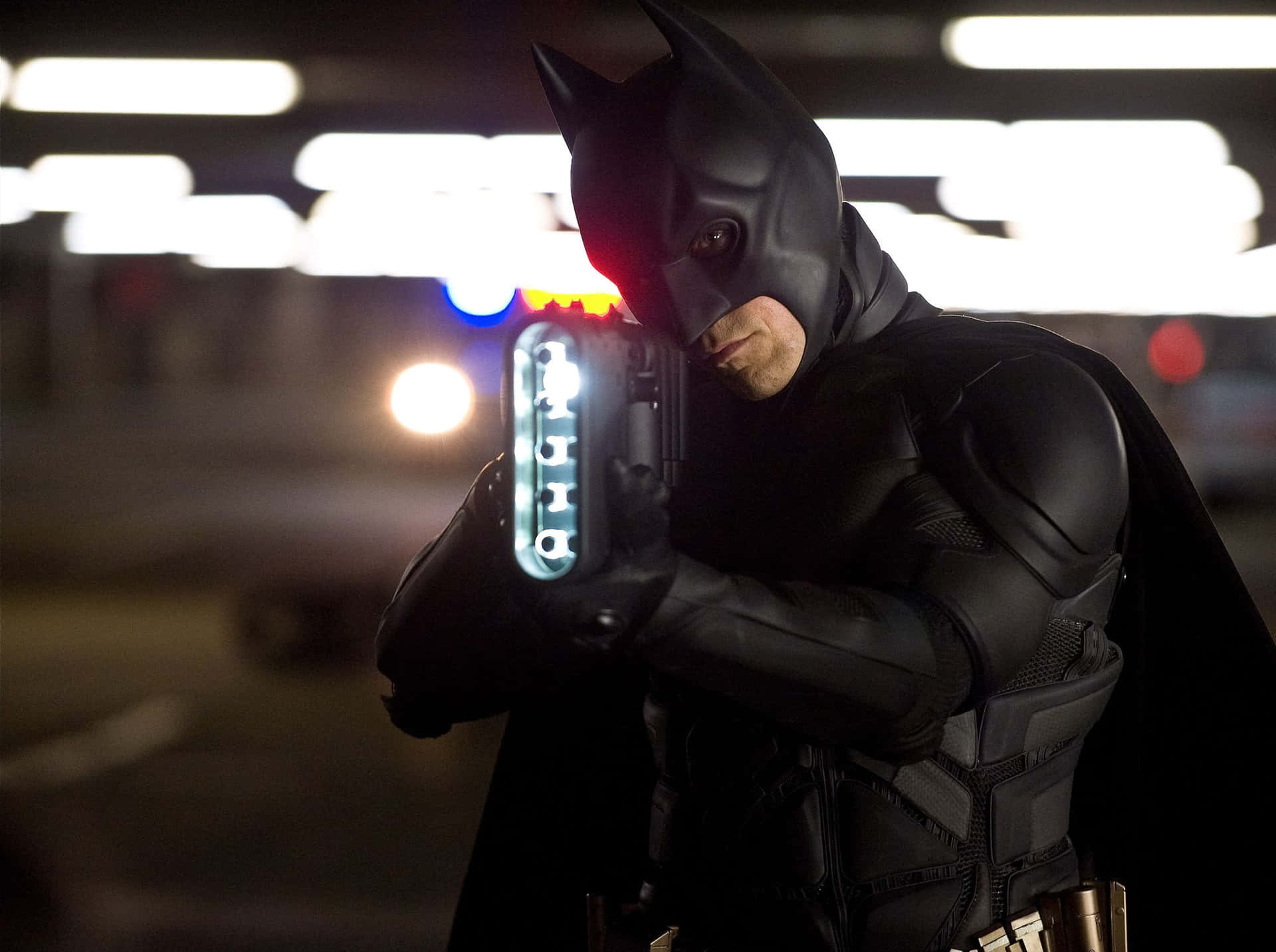 The Dark Knight Stands Tall in an Impressive Bat-suit Wallpaper