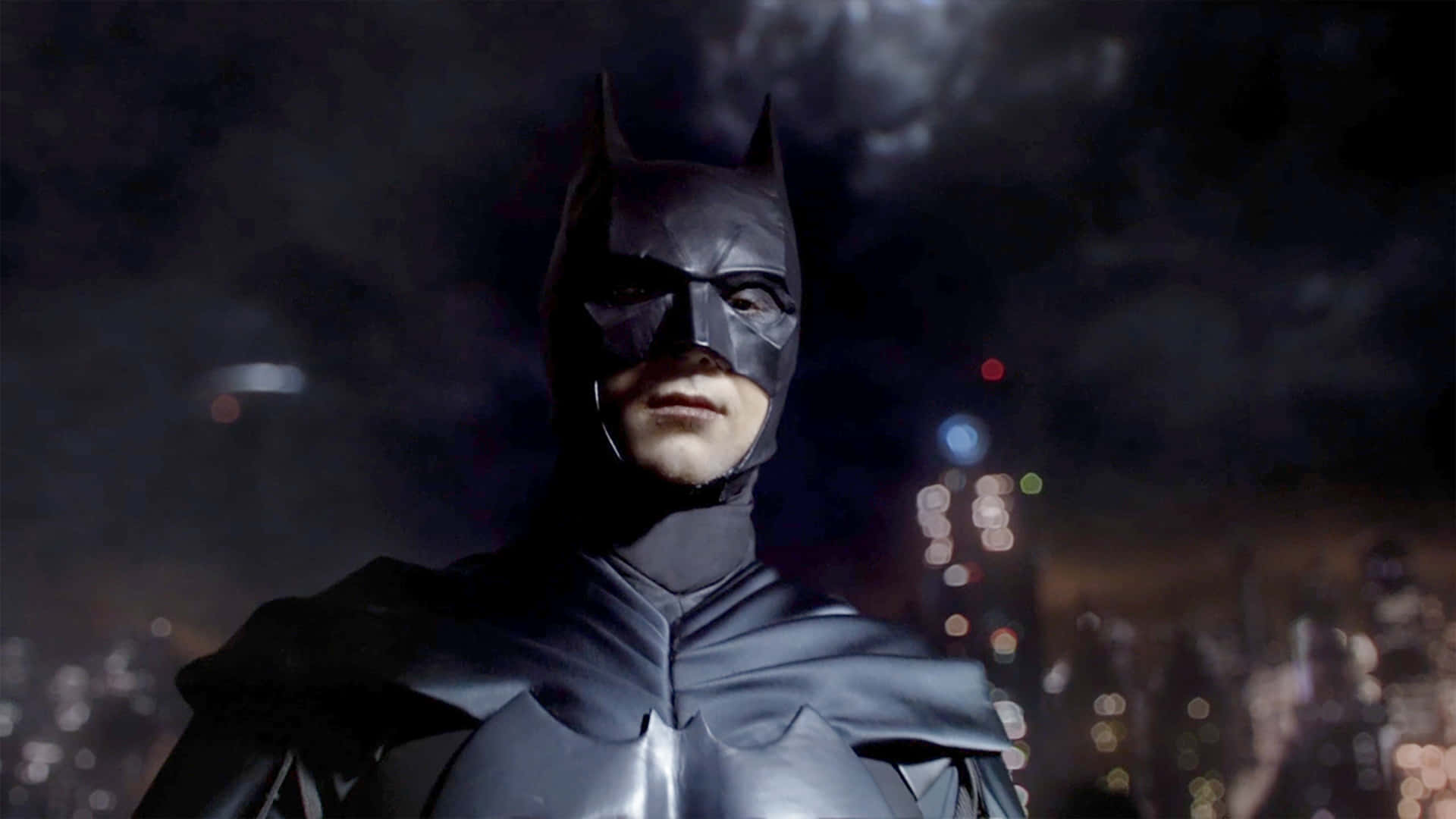 The Dark Knight's Bat-suit in action Wallpaper