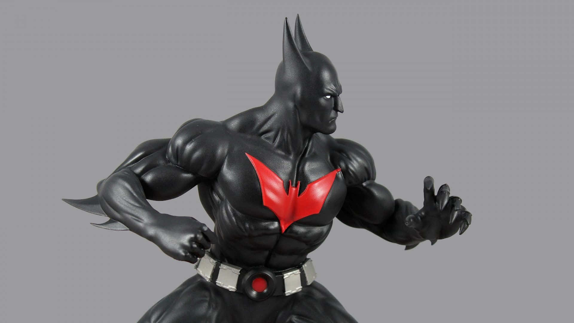 Batmanactionfigur Mit Rotem Und Schwarzem Kostüm