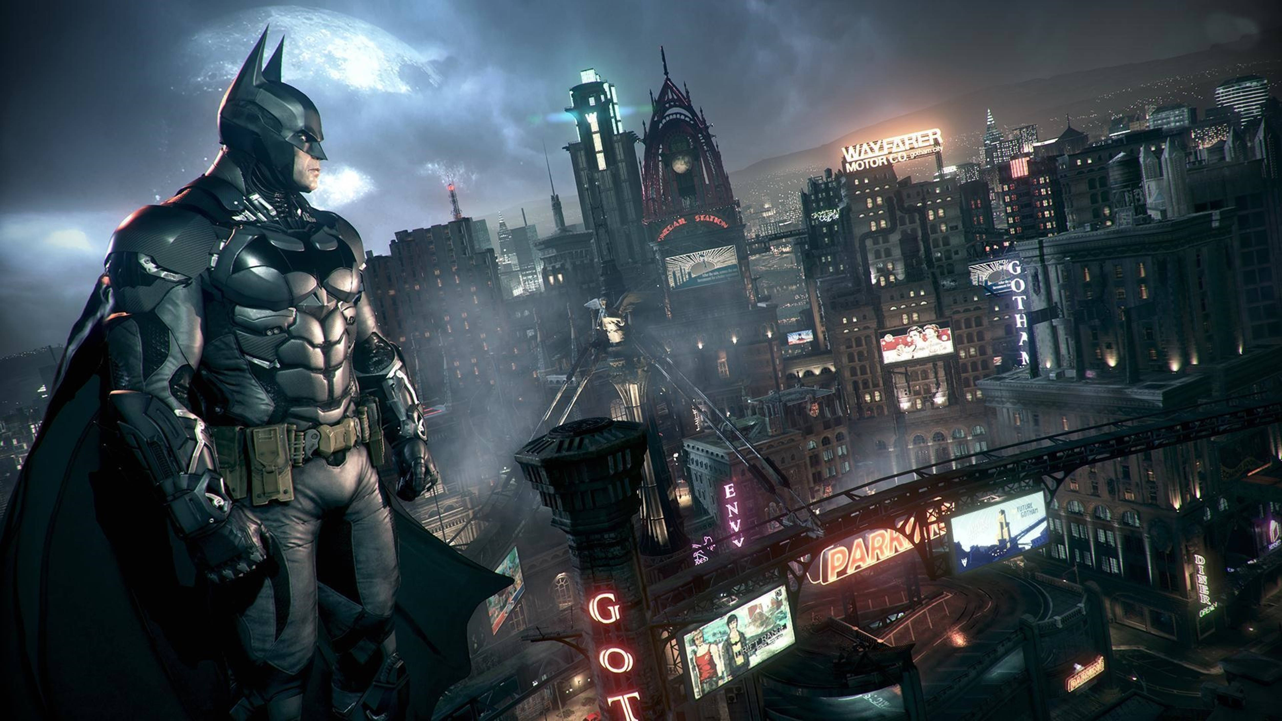 Batman Standing Over The Building Of Arkham City 4k Wallpaper