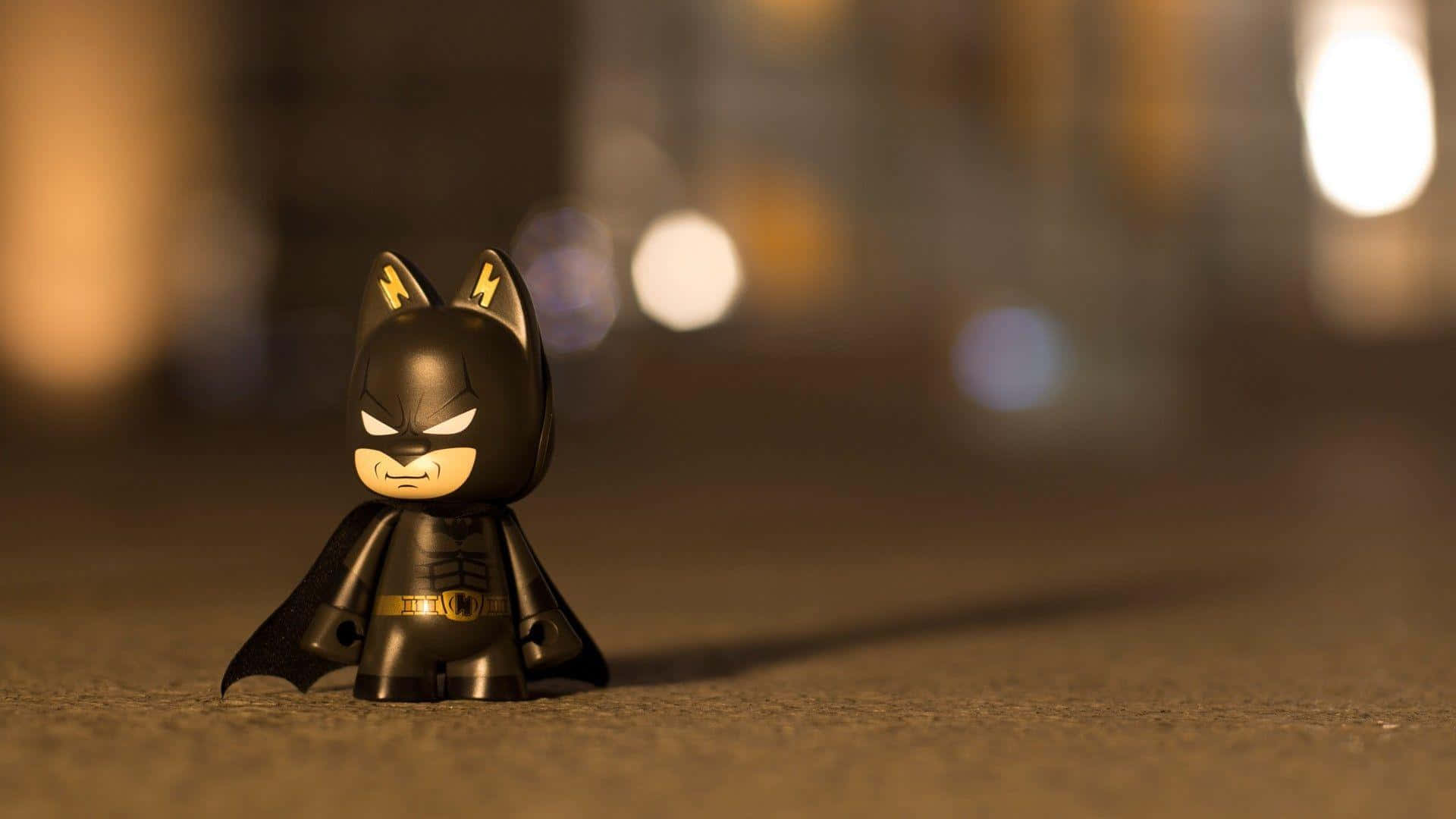 Batman Toy Figure Nighttime Bokeh Wallpaper
