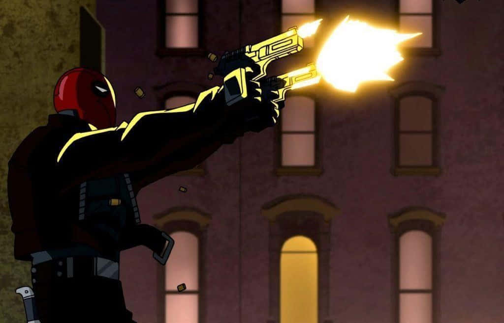 Batman and Red Hood Face off in an Epic Confrontation Wallpaper
