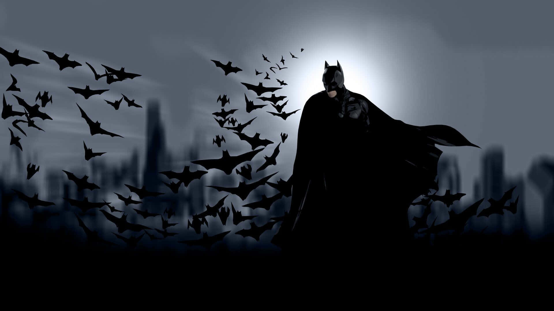 Batman In The Dark Sky With Bats Flying Around Him Wallpaper