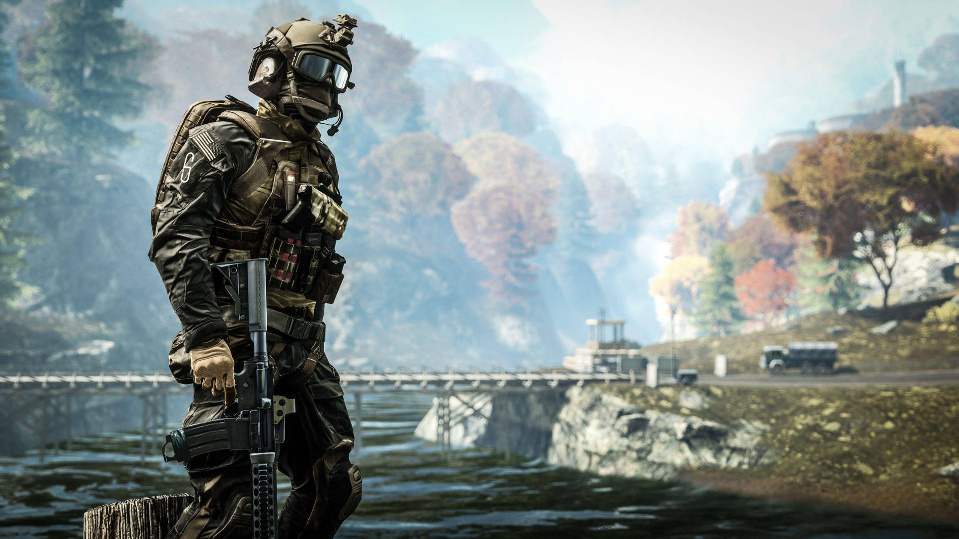 En soldat står på en bro ved en flod Wallpaper