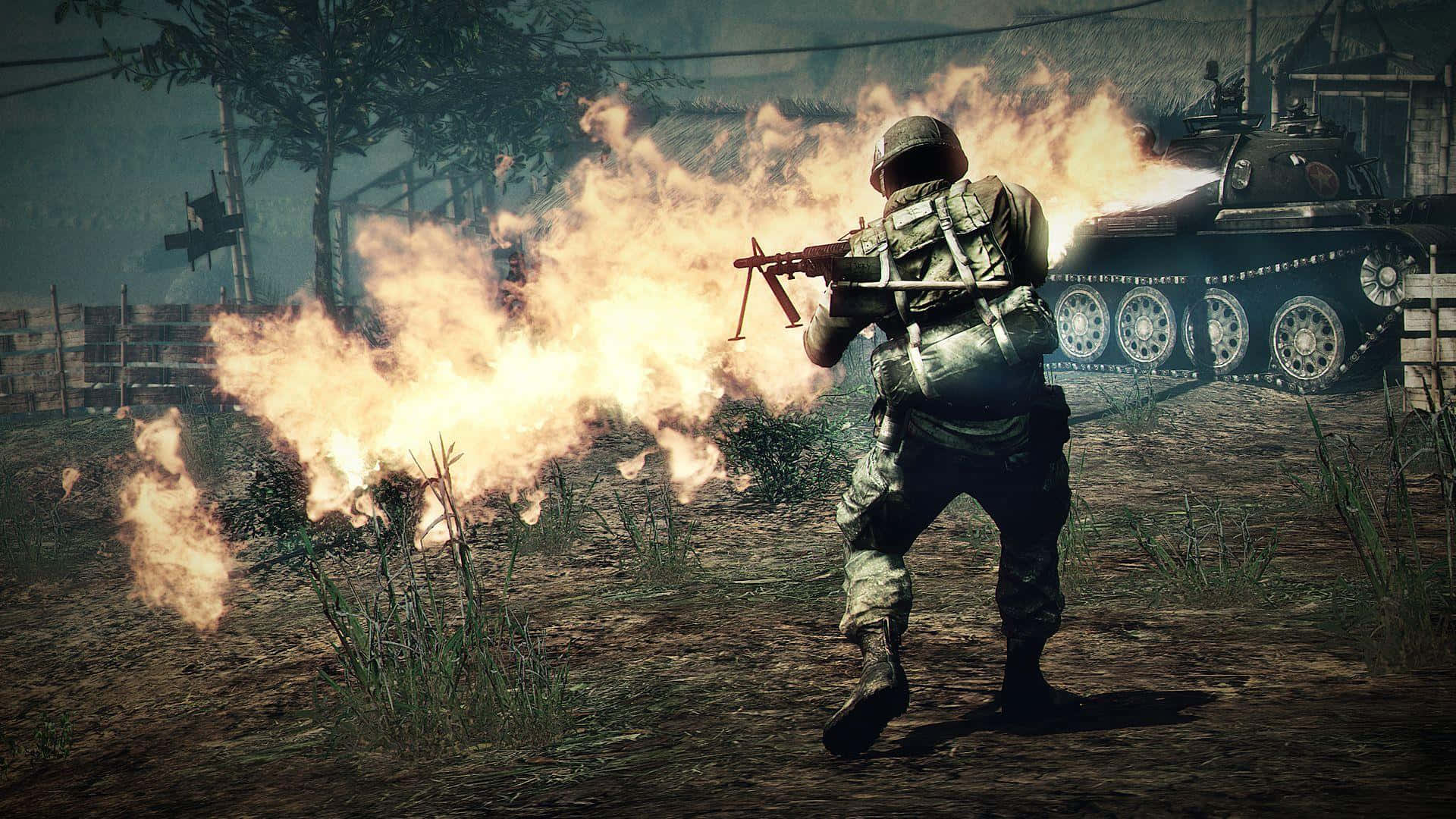 En soldat holder et gevær foran ilden.