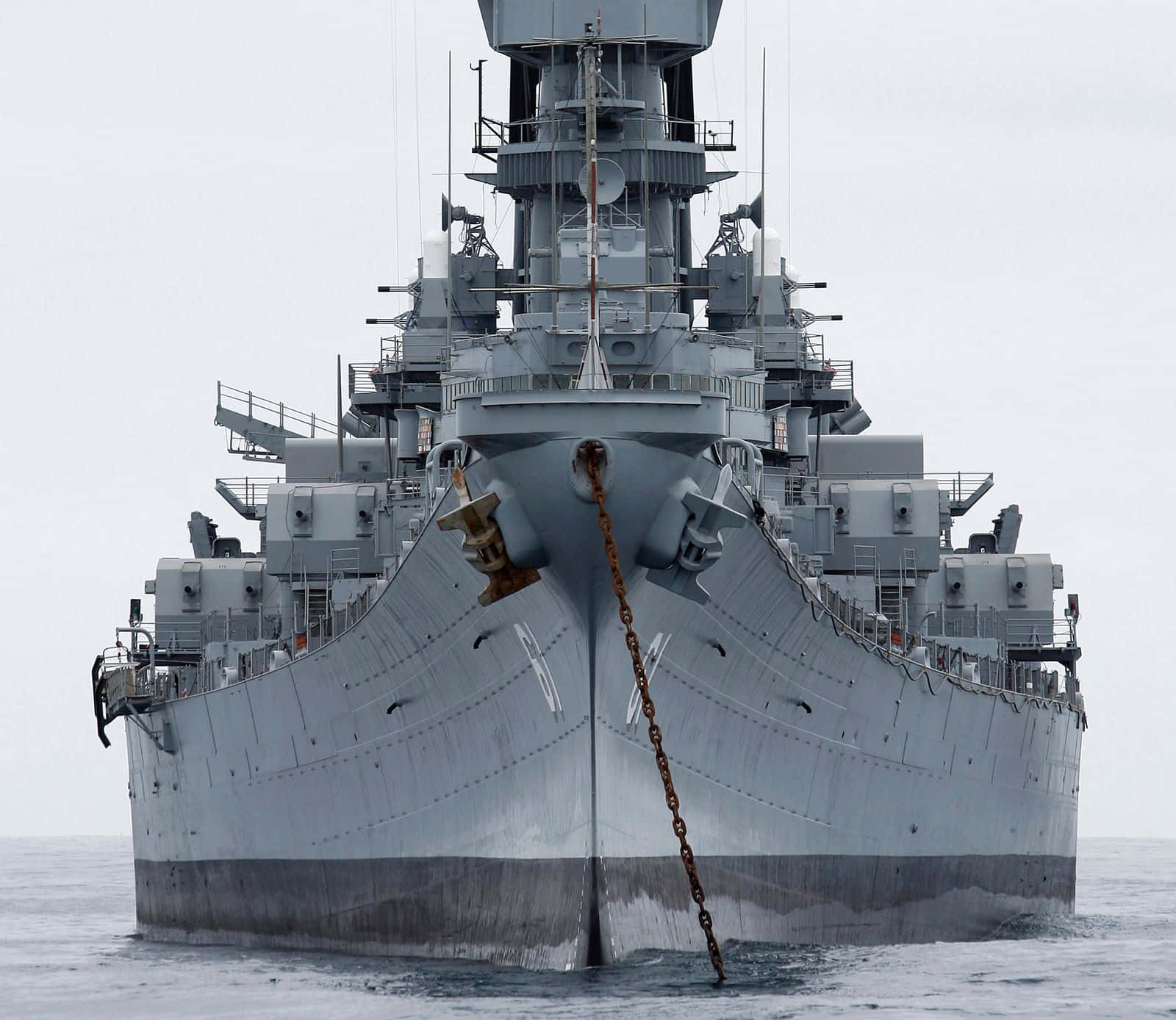 A Large Battleship Is Floating In The Water
