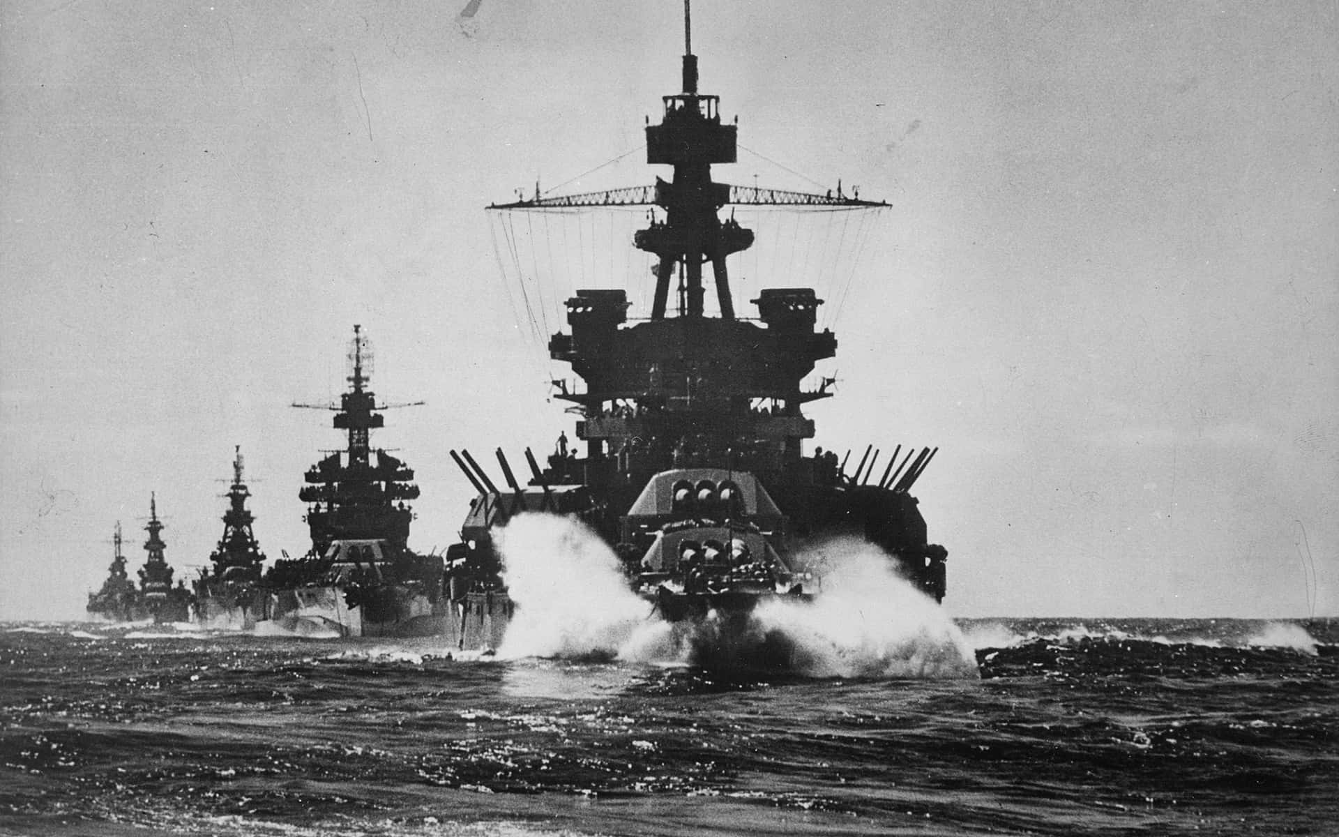 A Group Of Battleships In The Ocean