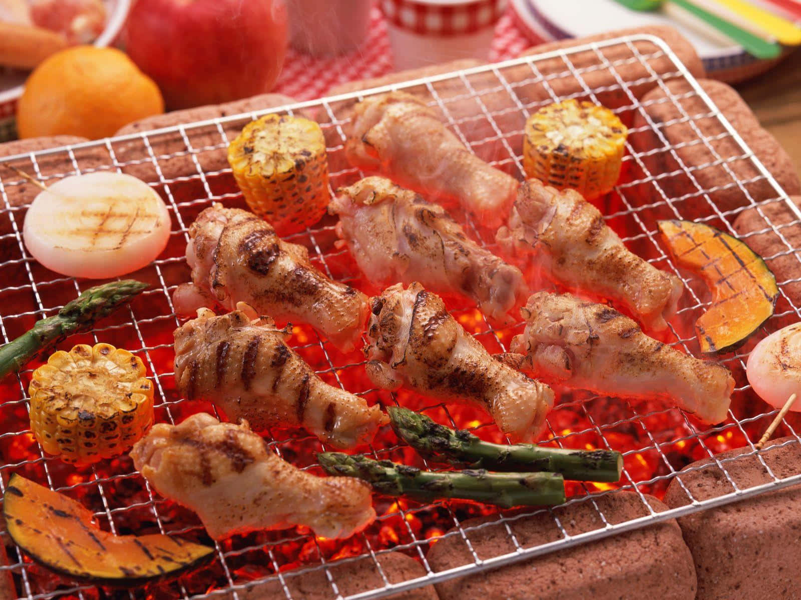 A Grill With Chicken And Vegetables On It