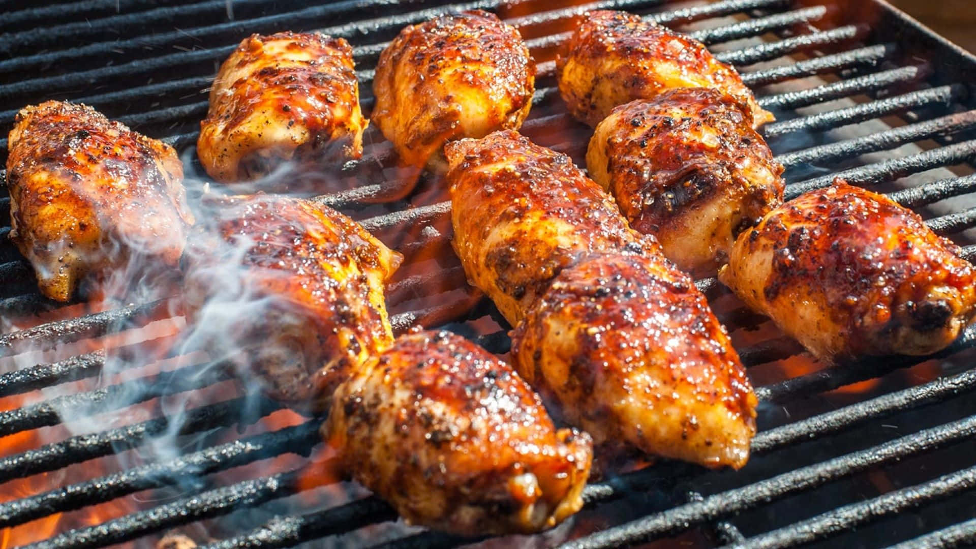 Grilled Chicken On A Grill With Smoke Coming Out Of It