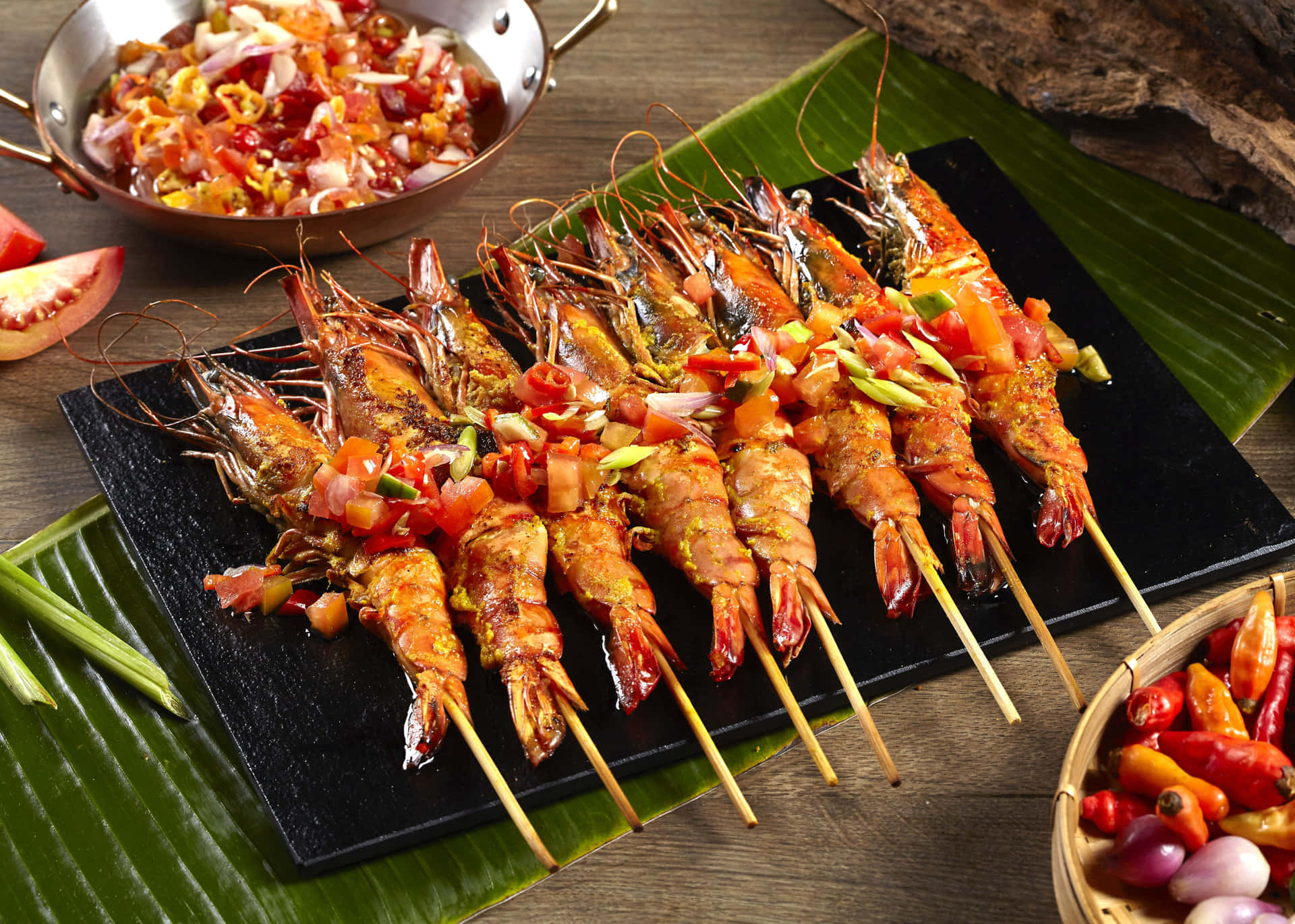 A Plate Of Grilled Shrimp On Skewers