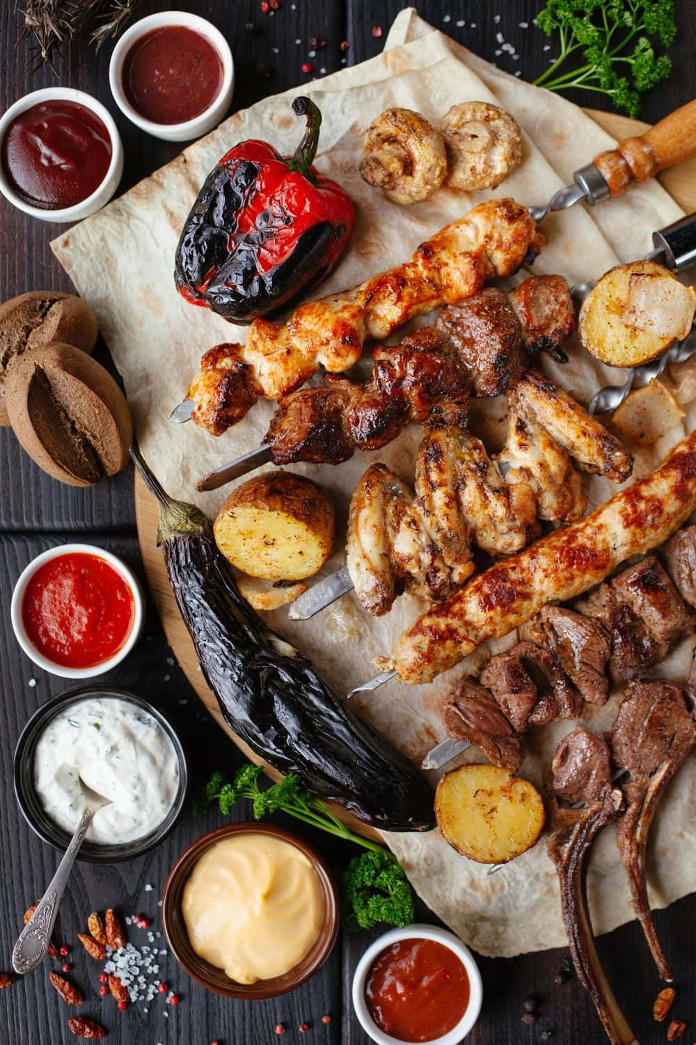 A Plate Of Grilled Meats And Vegetables