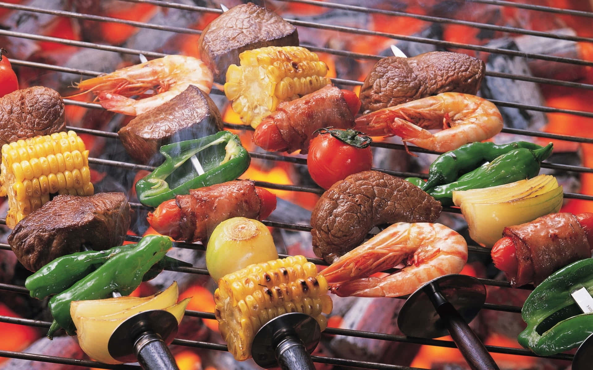 A Grill With Meat, Vegetables And Shrimp On It