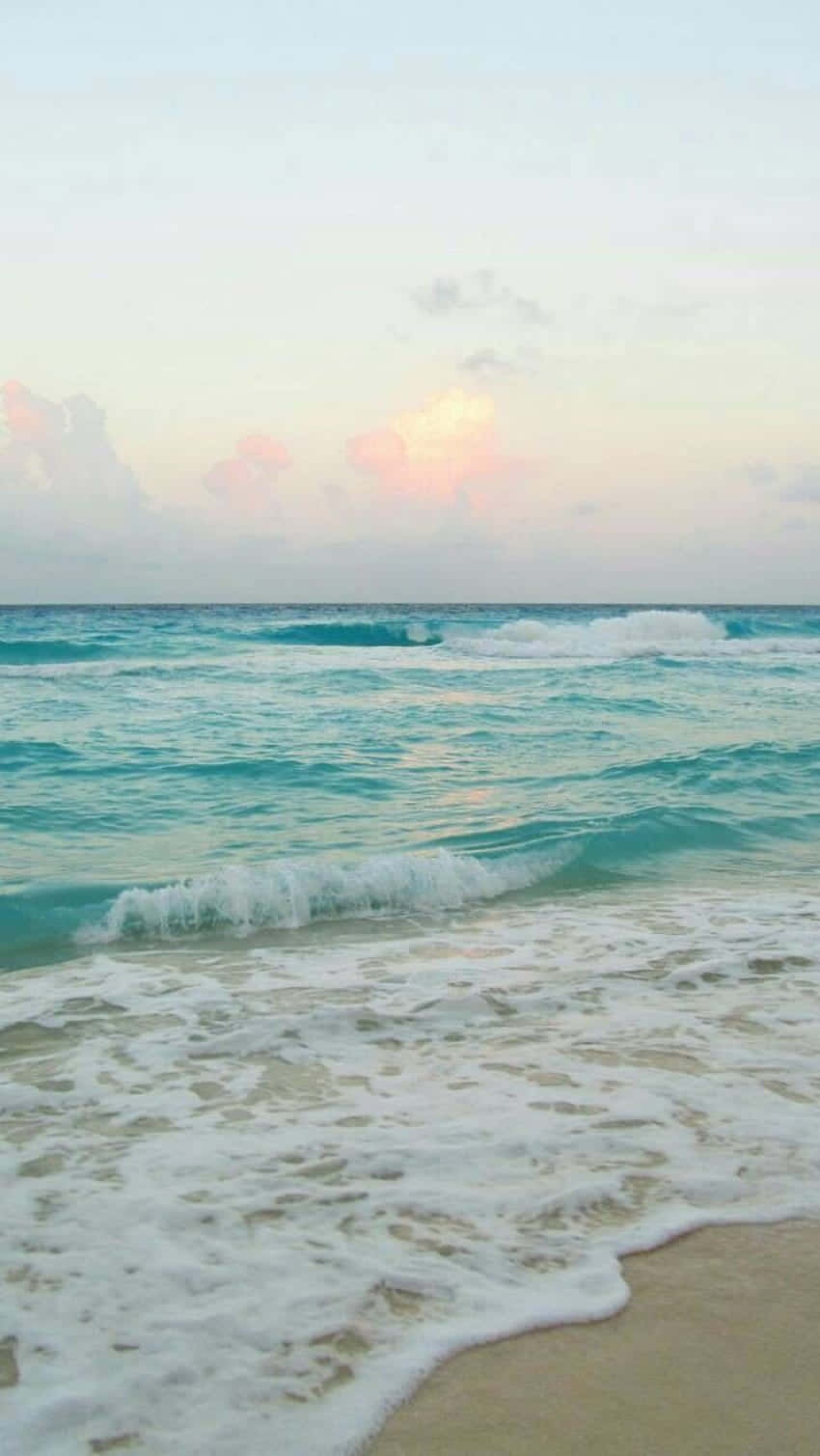 Disfrutade La Belleza De Un Día De Playa Tranquilo. Fondo de pantalla