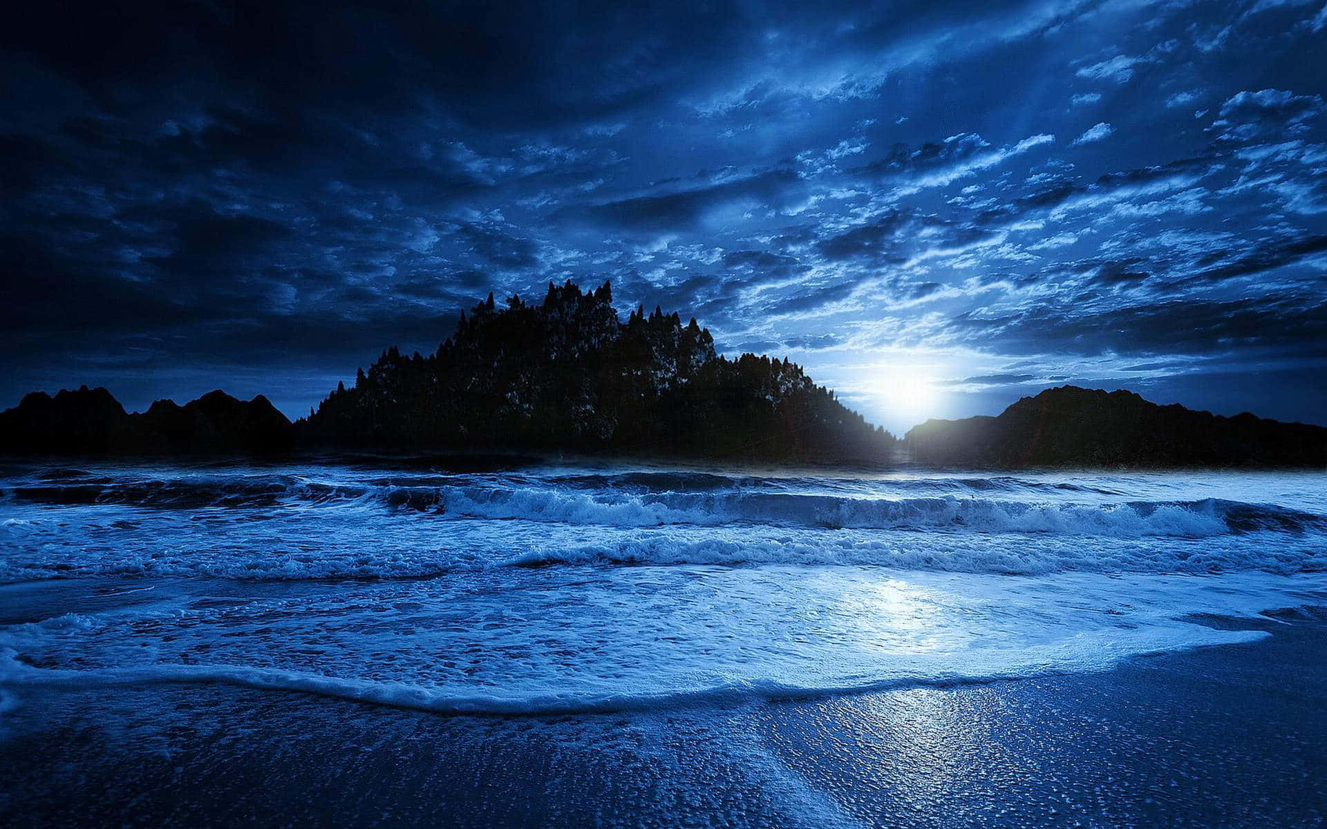 Enjoy the beauty of a beach at night.