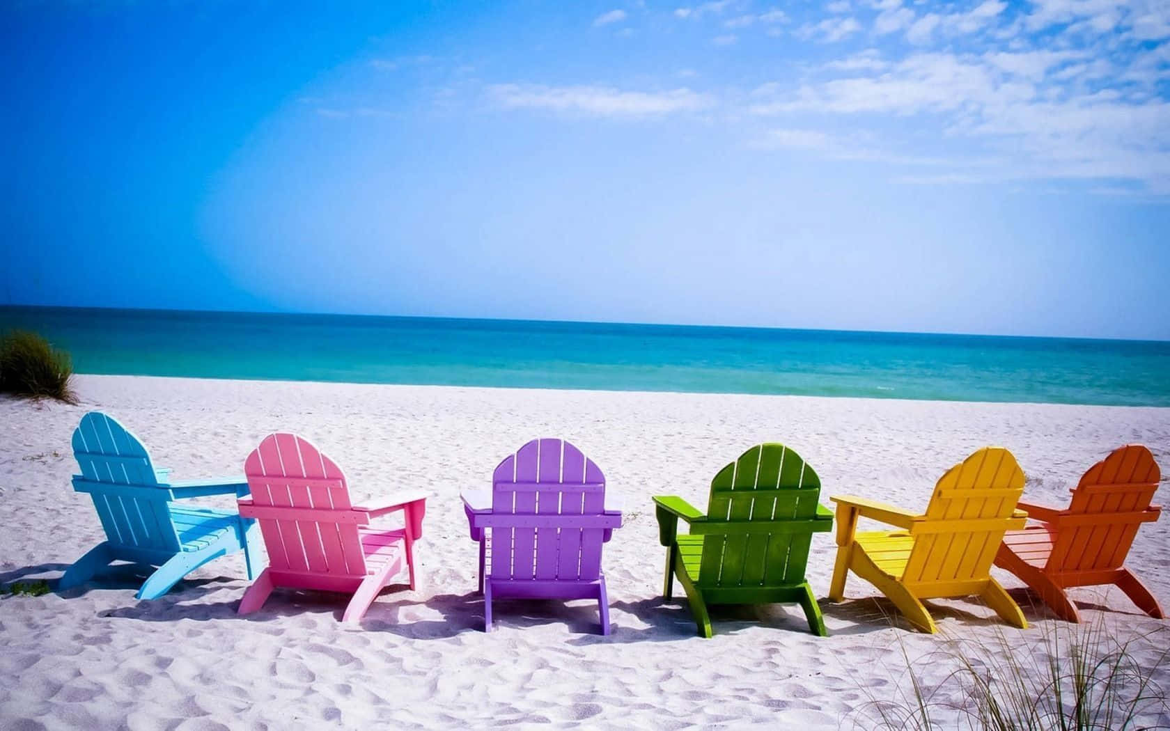 Rainbow Beach Chairs On Sand Background