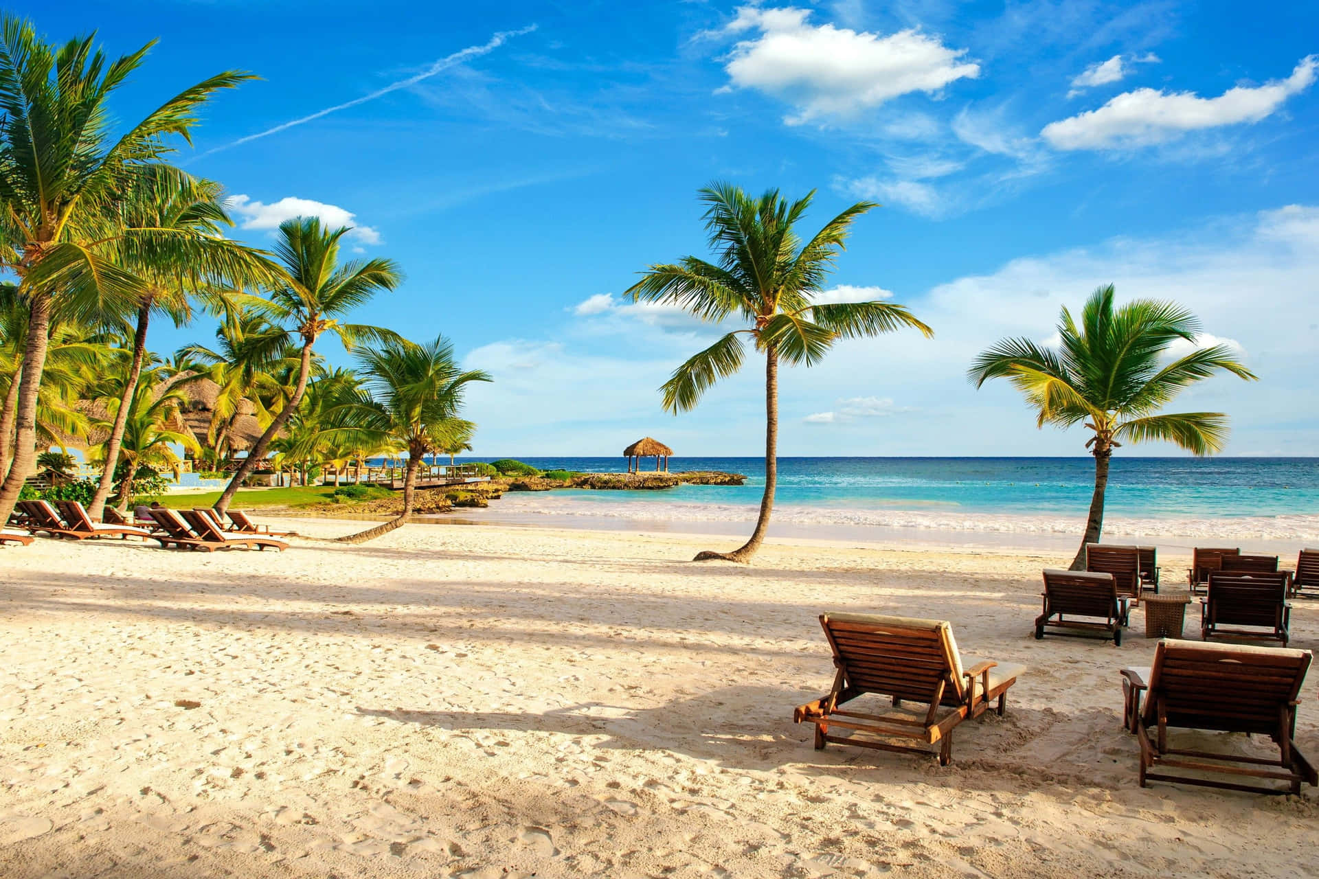 Wooden Beach Chairs On Fine Sand Background