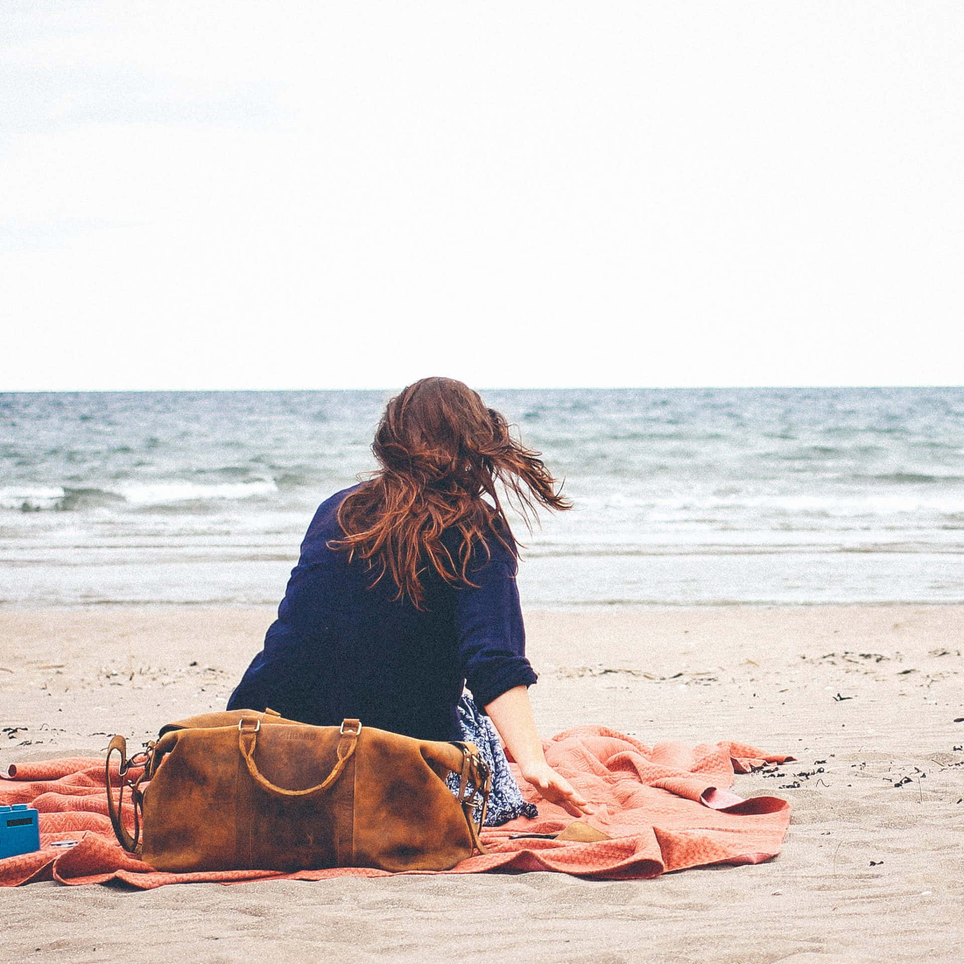 Stylish Beach Bag on Sunny Shore Wallpaper