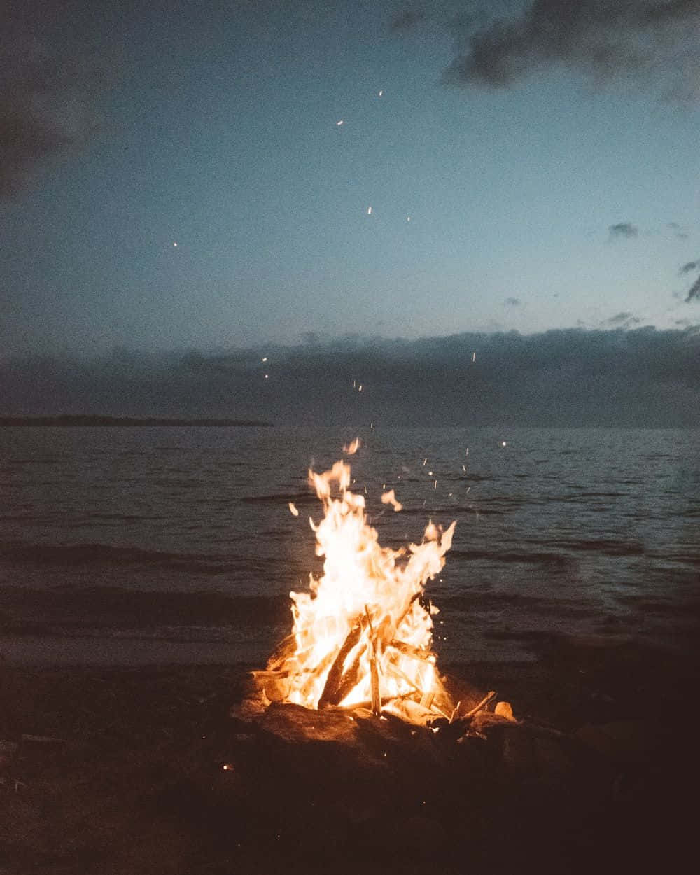 Relaxing Beach Bonfire Gathering Wallpaper