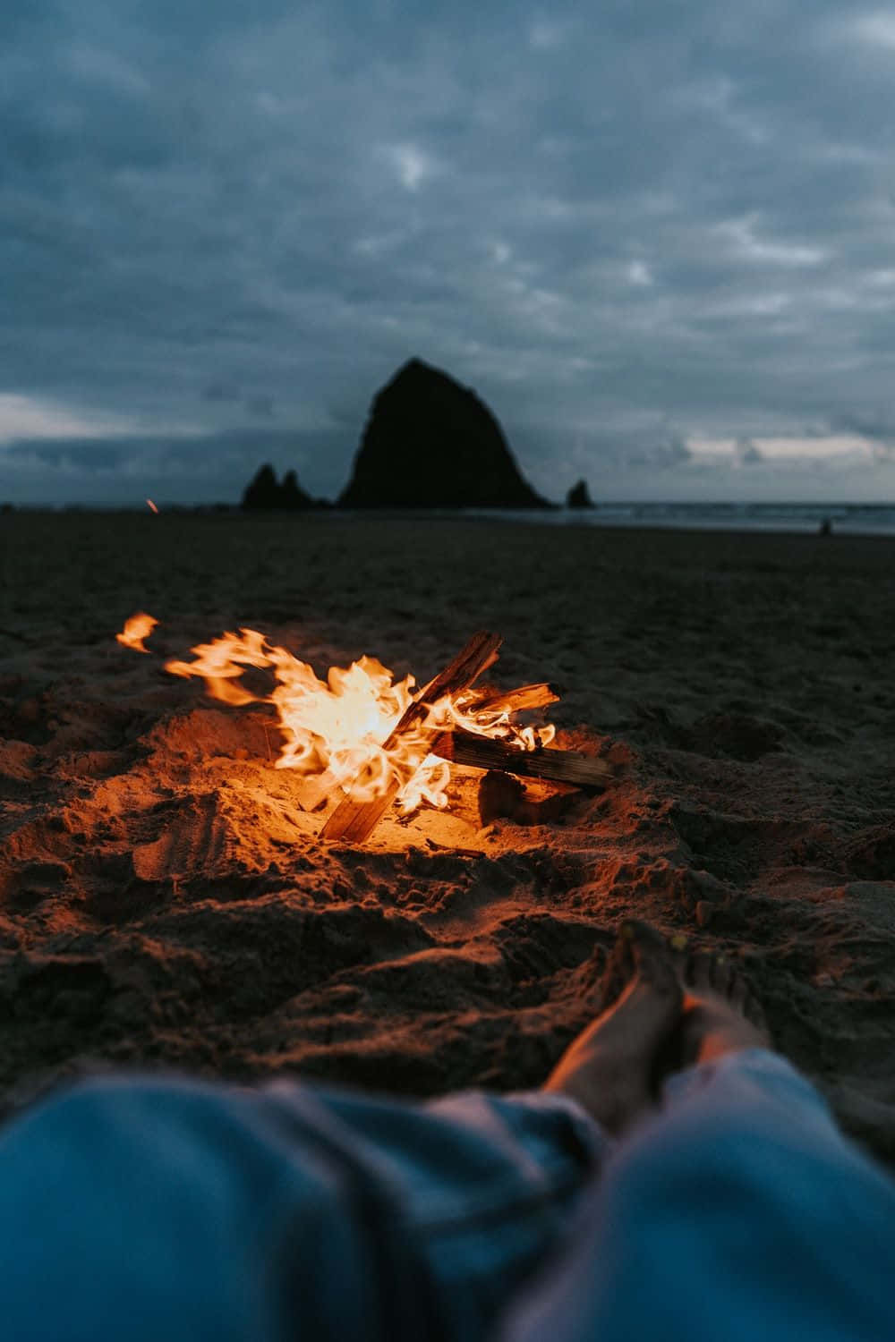 A tranquil beach bonfire moment Wallpaper