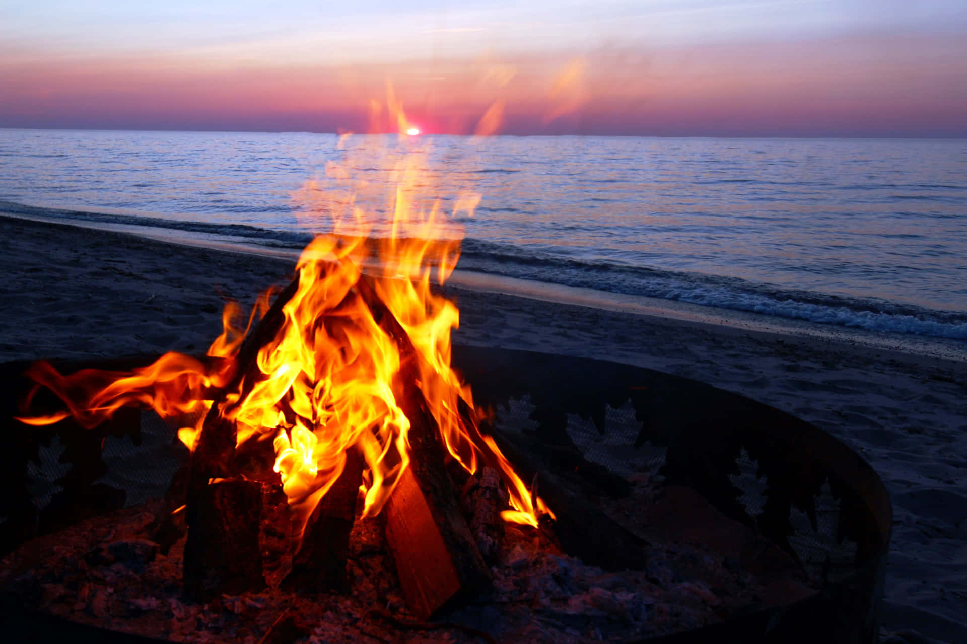 Beach Campfire Under A Starry Night Sky Wallpaper