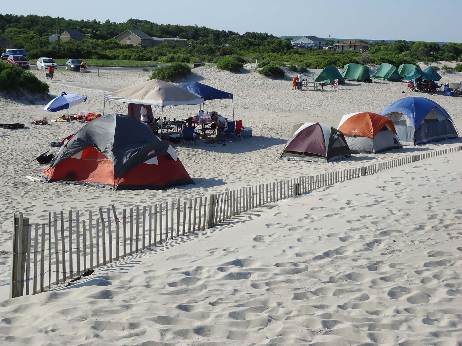 Caption: A Serene Beach Campsite at Dusk Wallpaper