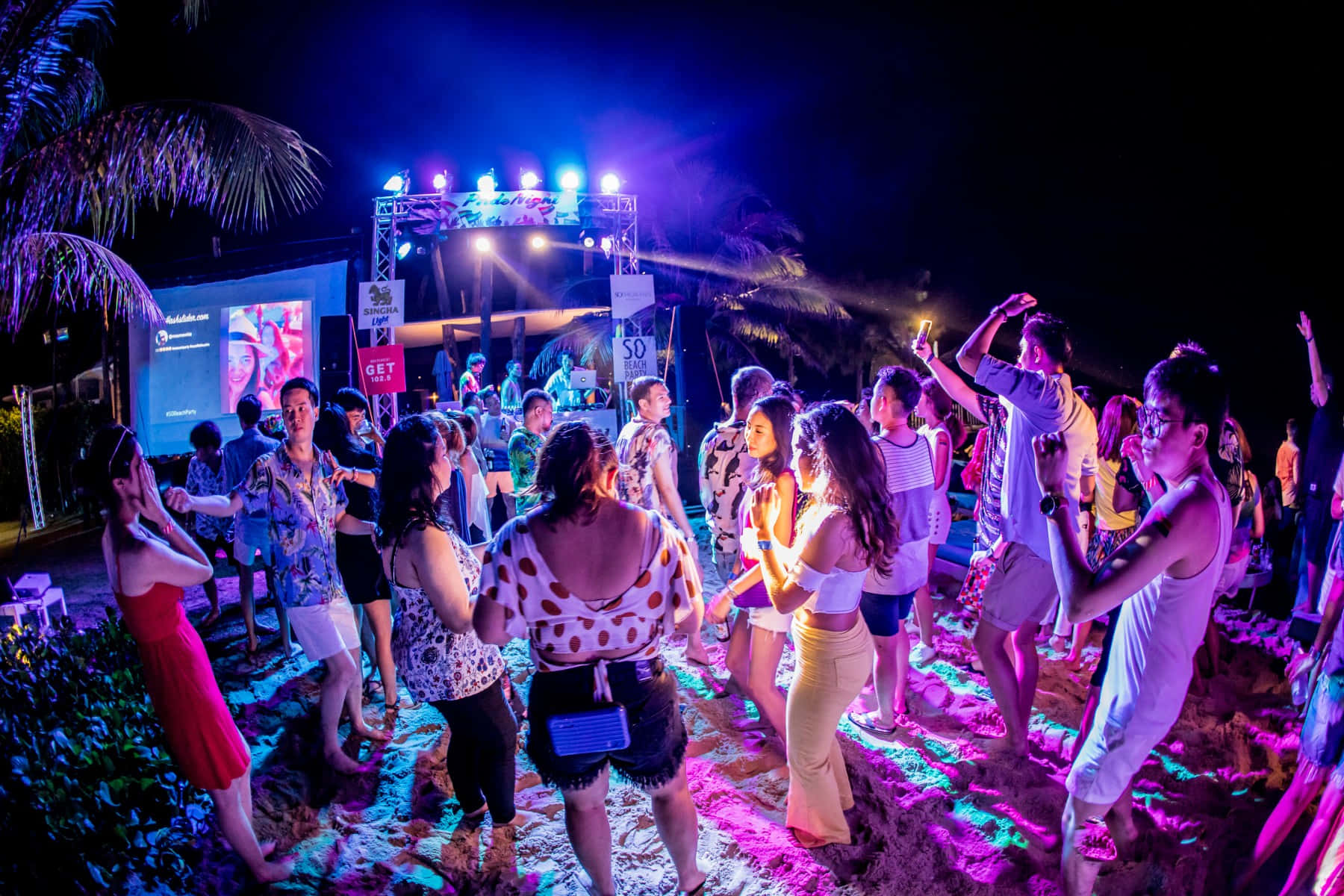 Vibrant Beach Dance Party Wallpaper