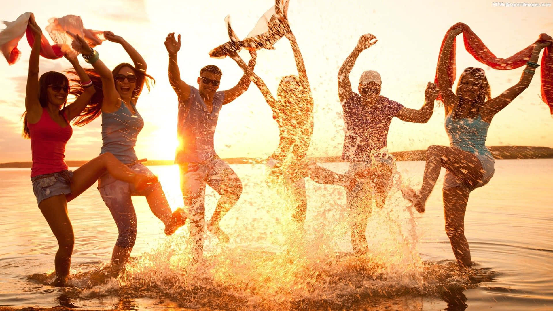 Beach Dance Party with Energetic Crowd Wallpaper