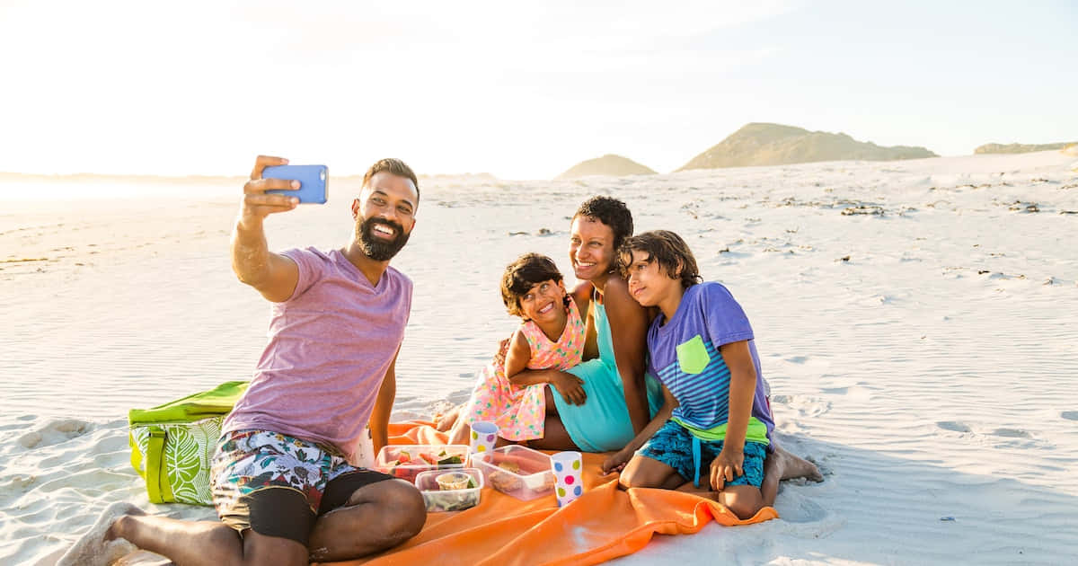 "Making Life-Long Memories: A Beach Family Enjoys Their Vacation"