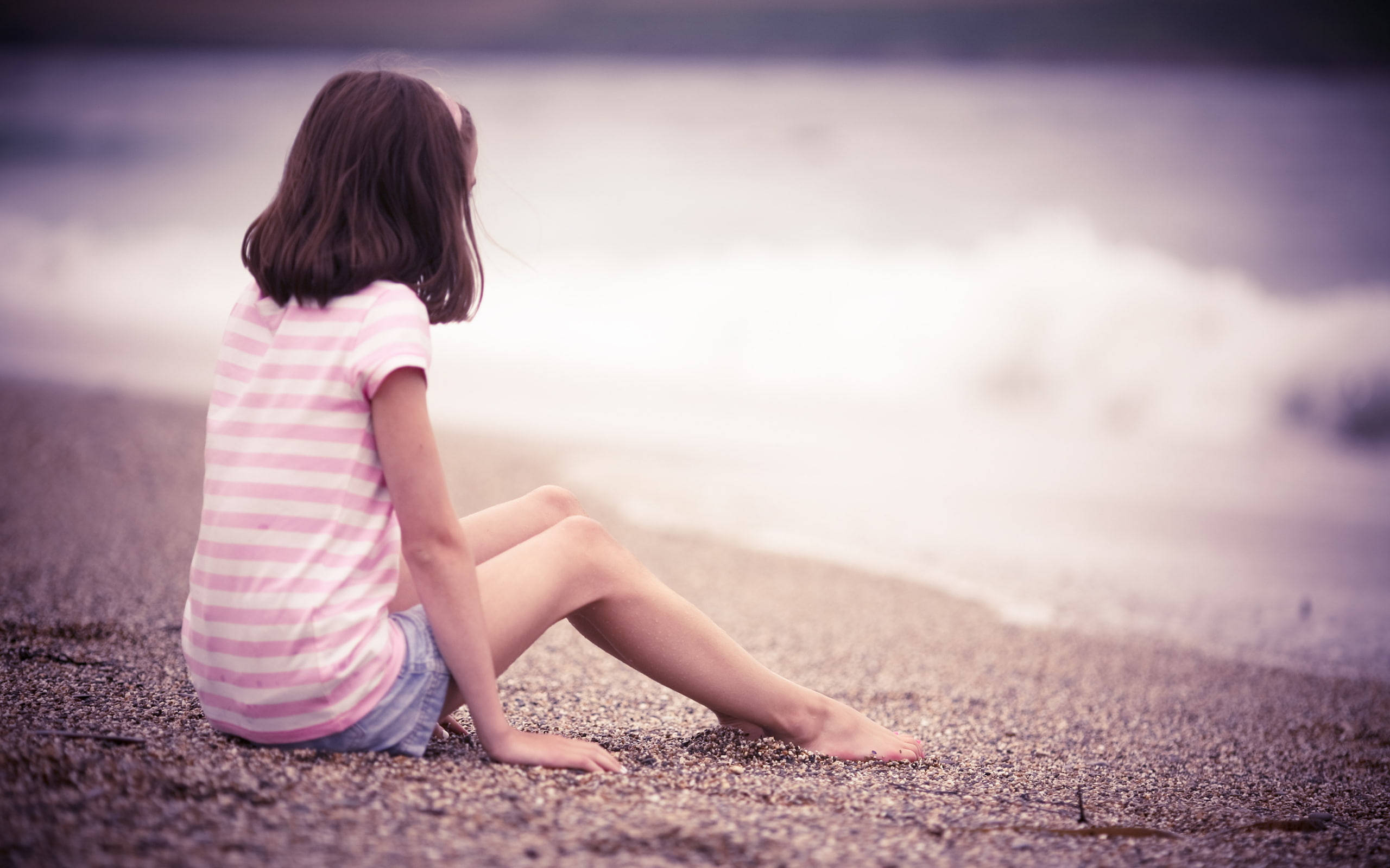 Beach Girl Sitting Near Water Wallpaper