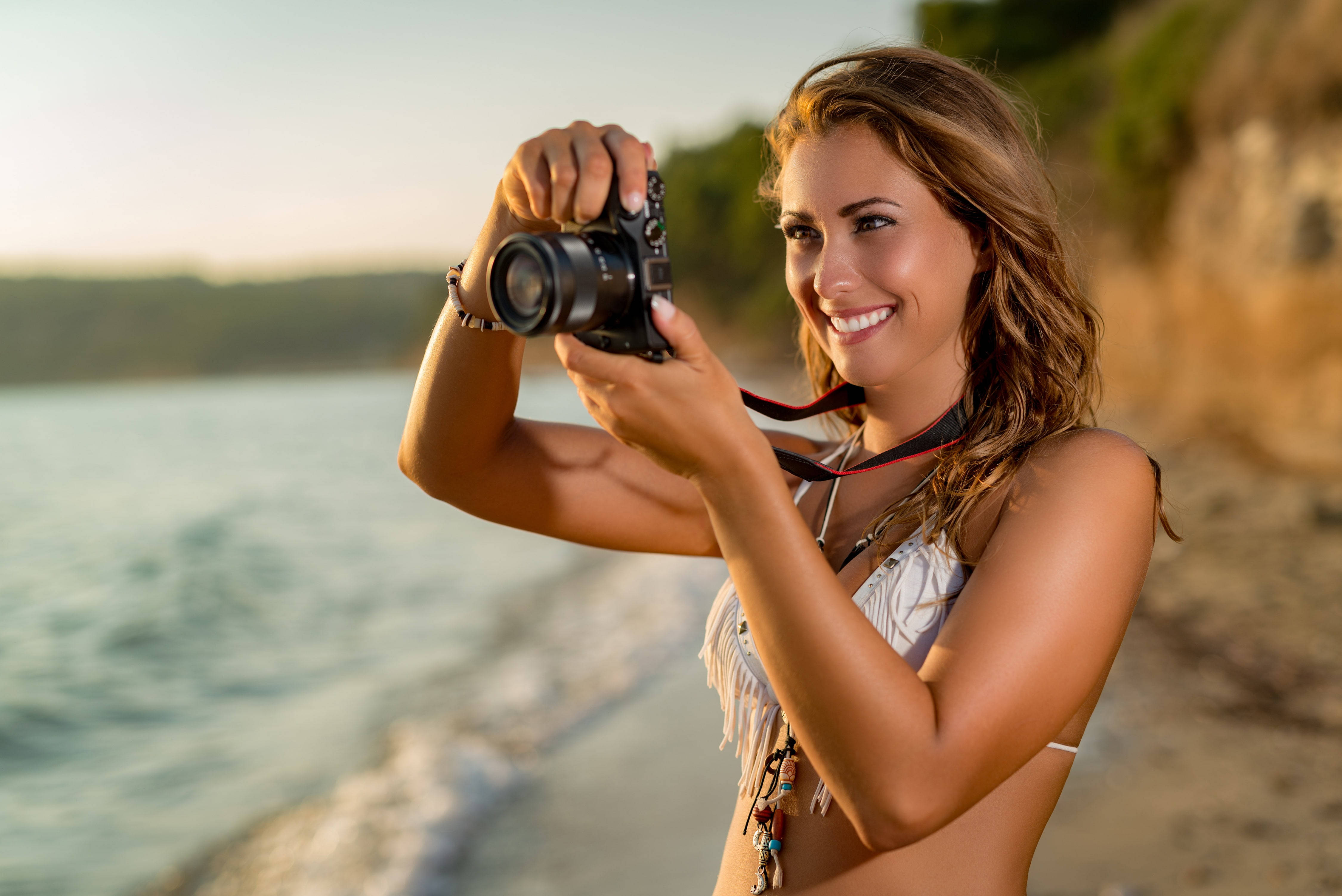 Beach Girl With Camera Wallpaper