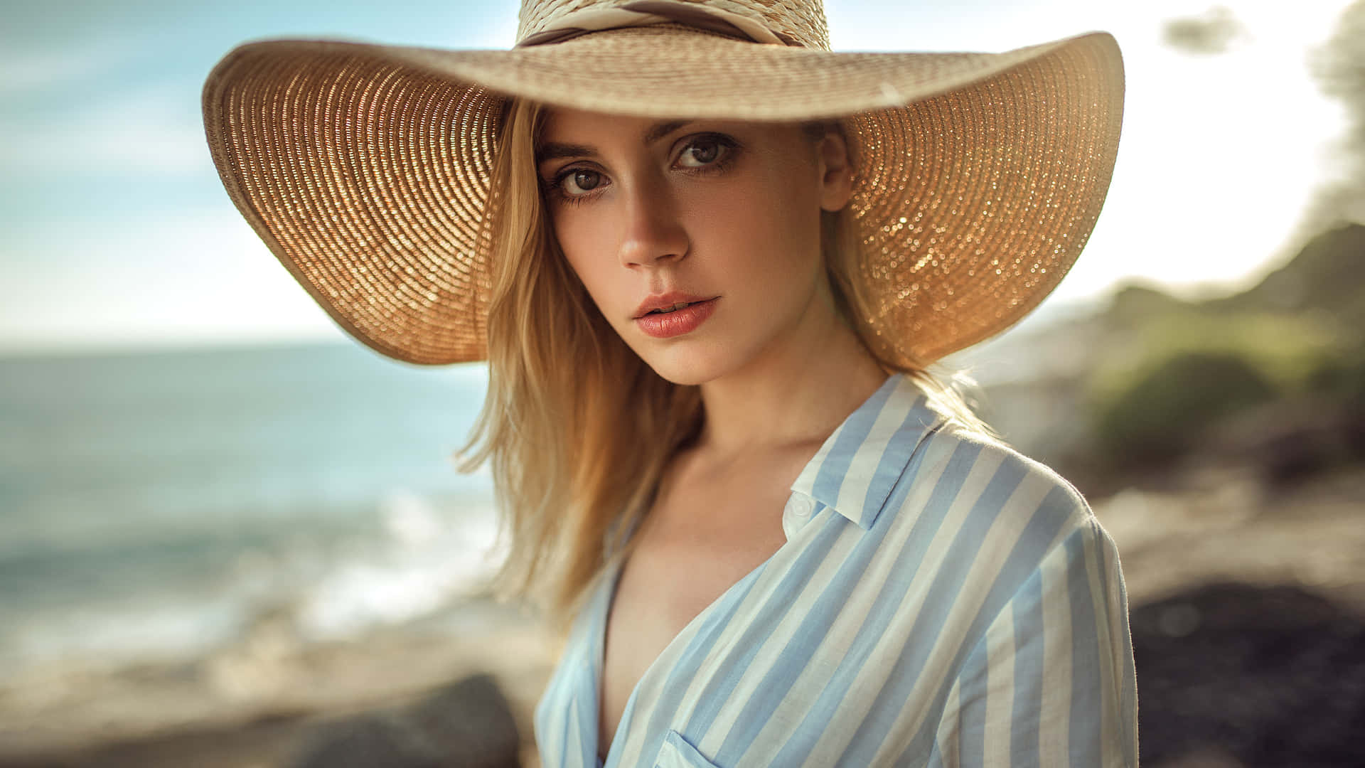 Relaxing Beach Day with a Stylish Hat Wallpaper