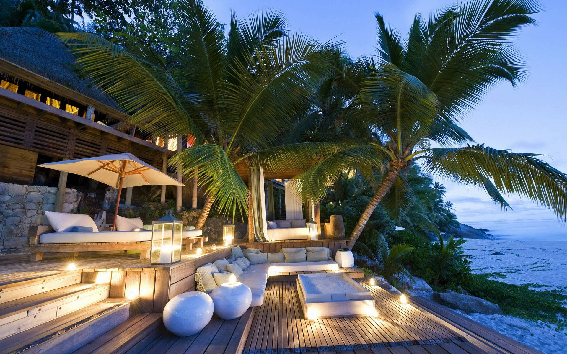 Majestic Beach House Overlooking the Crystal Clear Waters of Seychelles Wallpaper