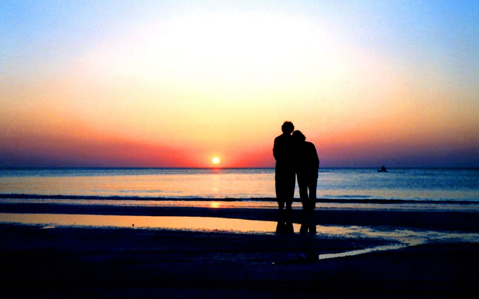Romantic Sunset Beach Stroll for Two Wallpaper