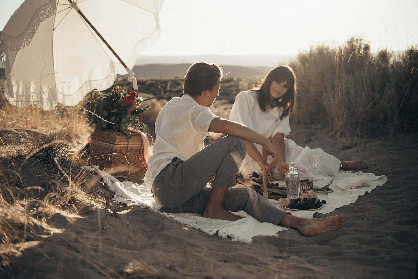 Picturesque Beach Picnic Setup on a Sunny Day Wallpaper