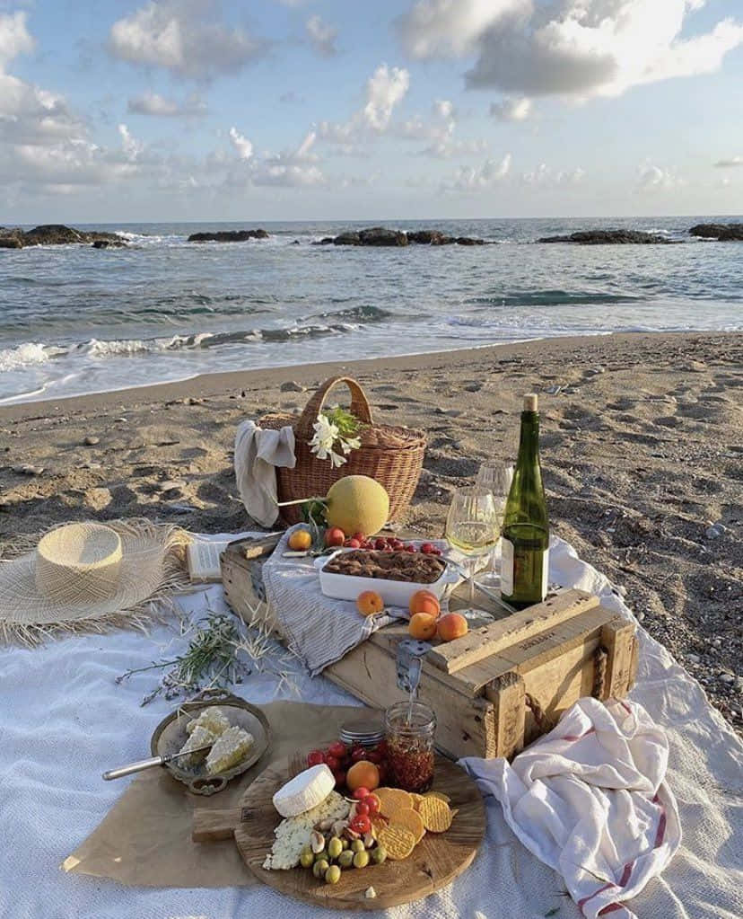 A Beautiful Day at a Beach Picnic with Friends and Family Wallpaper